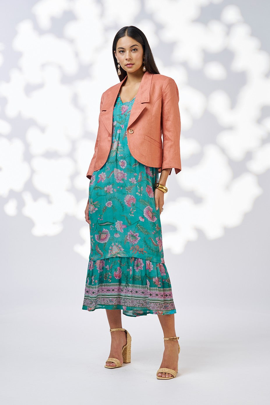 midi dress in aqua floral print and peach blazer worn by model