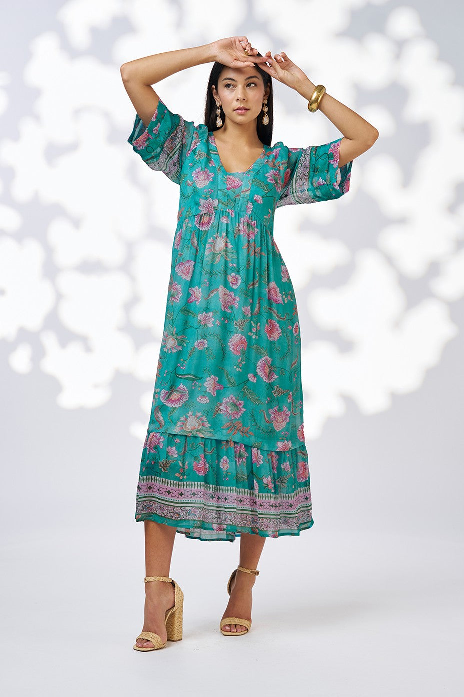 midi dress in aqua floral print worn by model