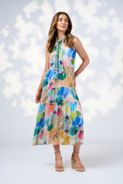 watercolour floral tiered sleeveless midi dress worn by model 