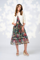 floral tulle layer midi dress and white jacket worn by model 