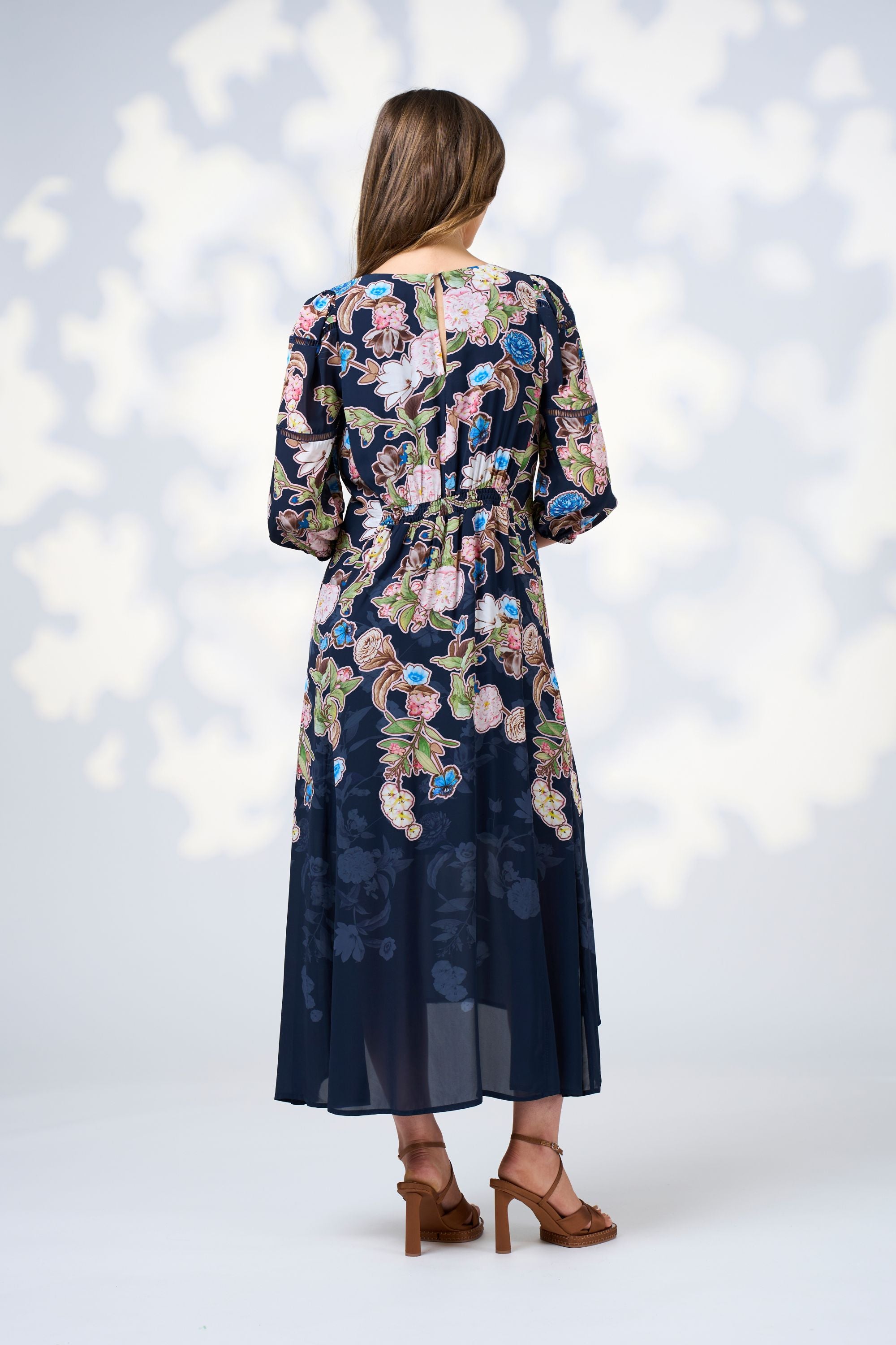 womens midi dress flowy skirt with long sleeve floral indigo worn by model back view