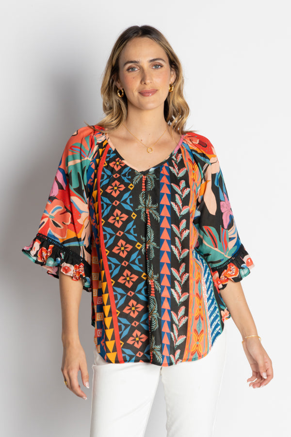 model wearing multi geometrical and floral print blouse