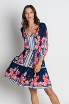 navy and pink floral midi dress worn by model 