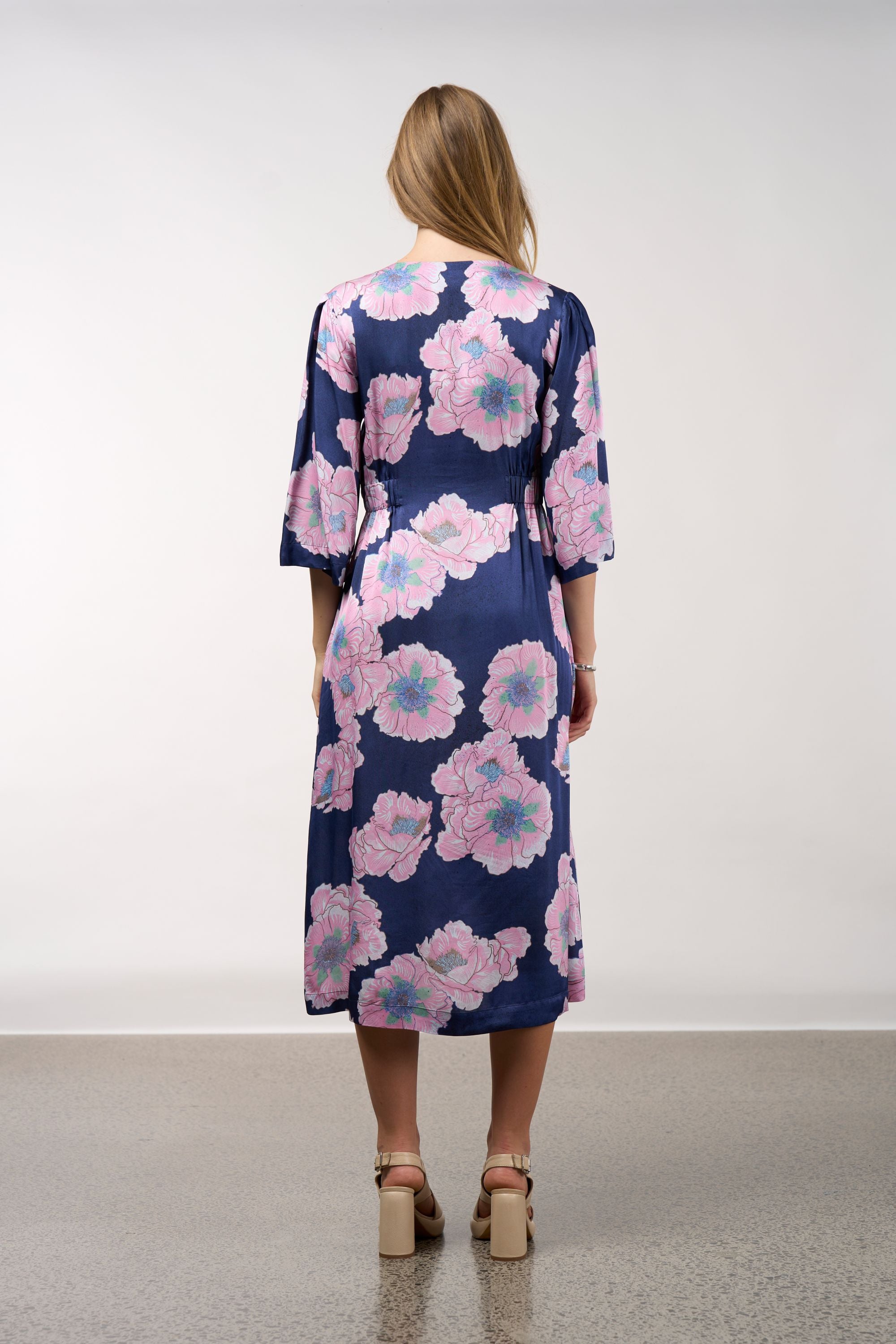 midi dress in navy with pink flowers worn by model back view