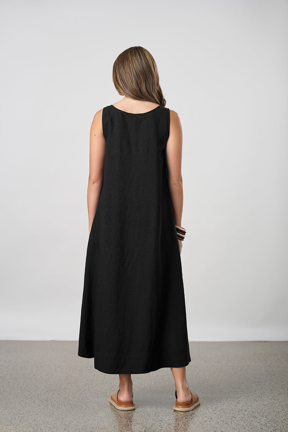 pleat maxi dress black worn by model back view