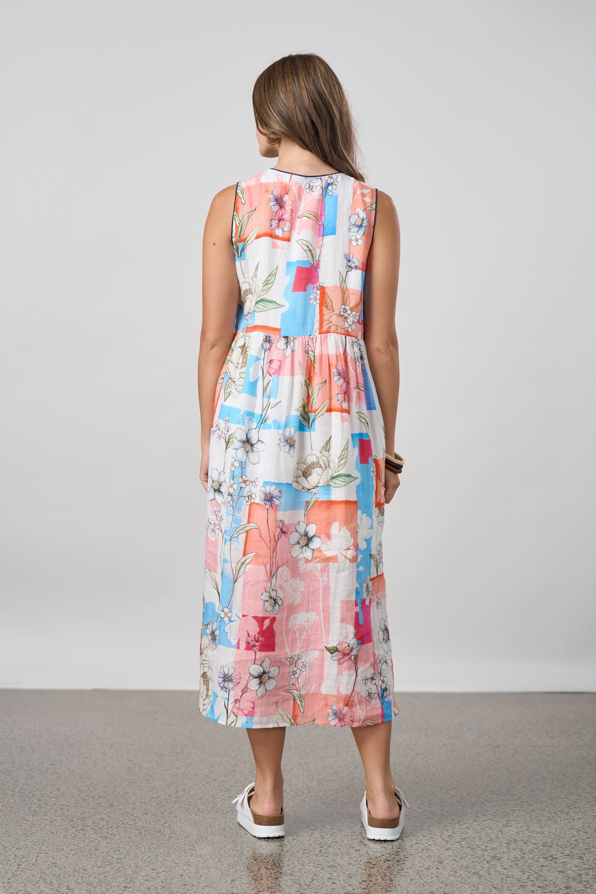 pink multi patchwork long sleeveless dress worn by model back view