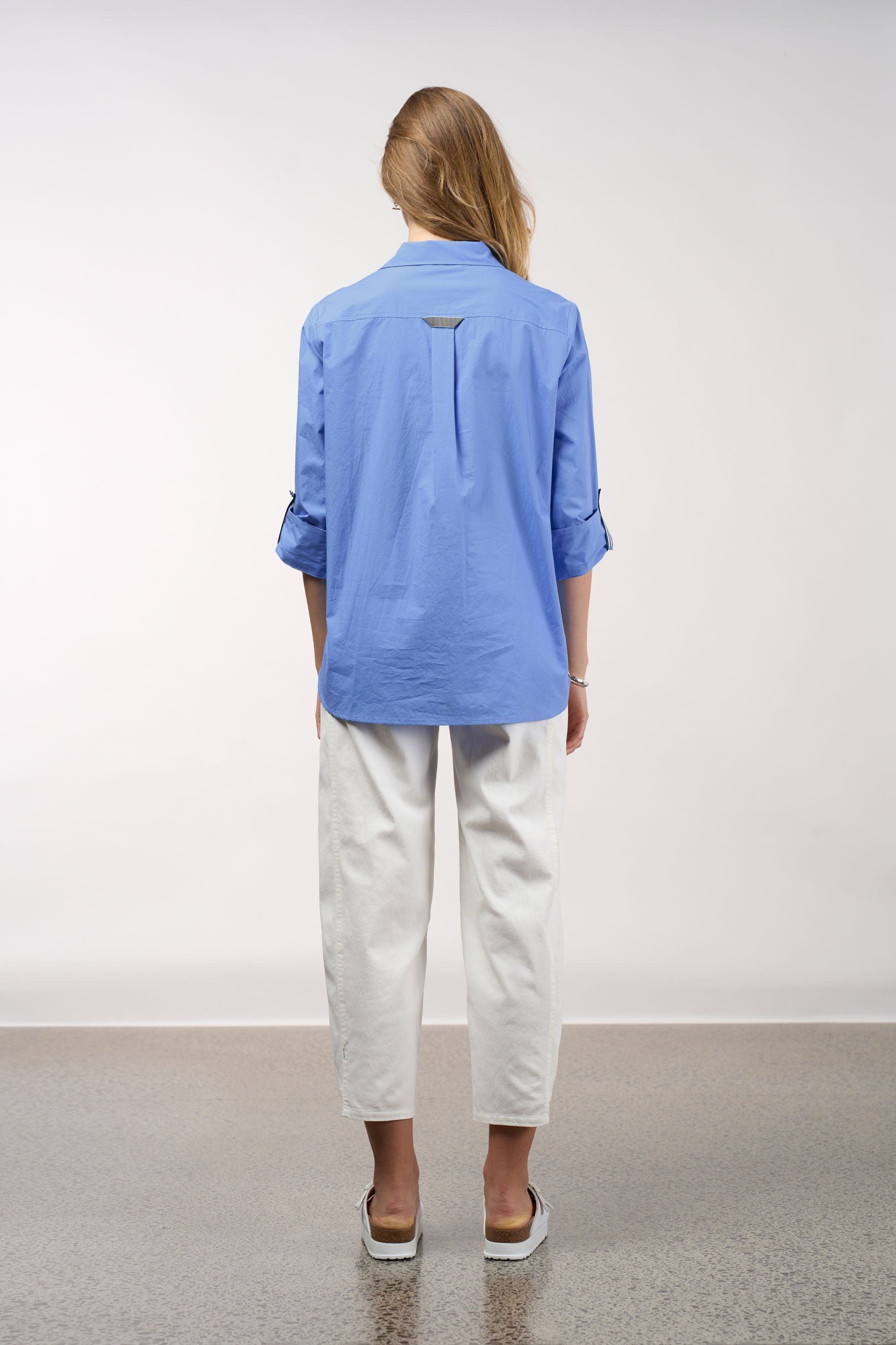 womens shirt blue with stripe trims worn by model back view