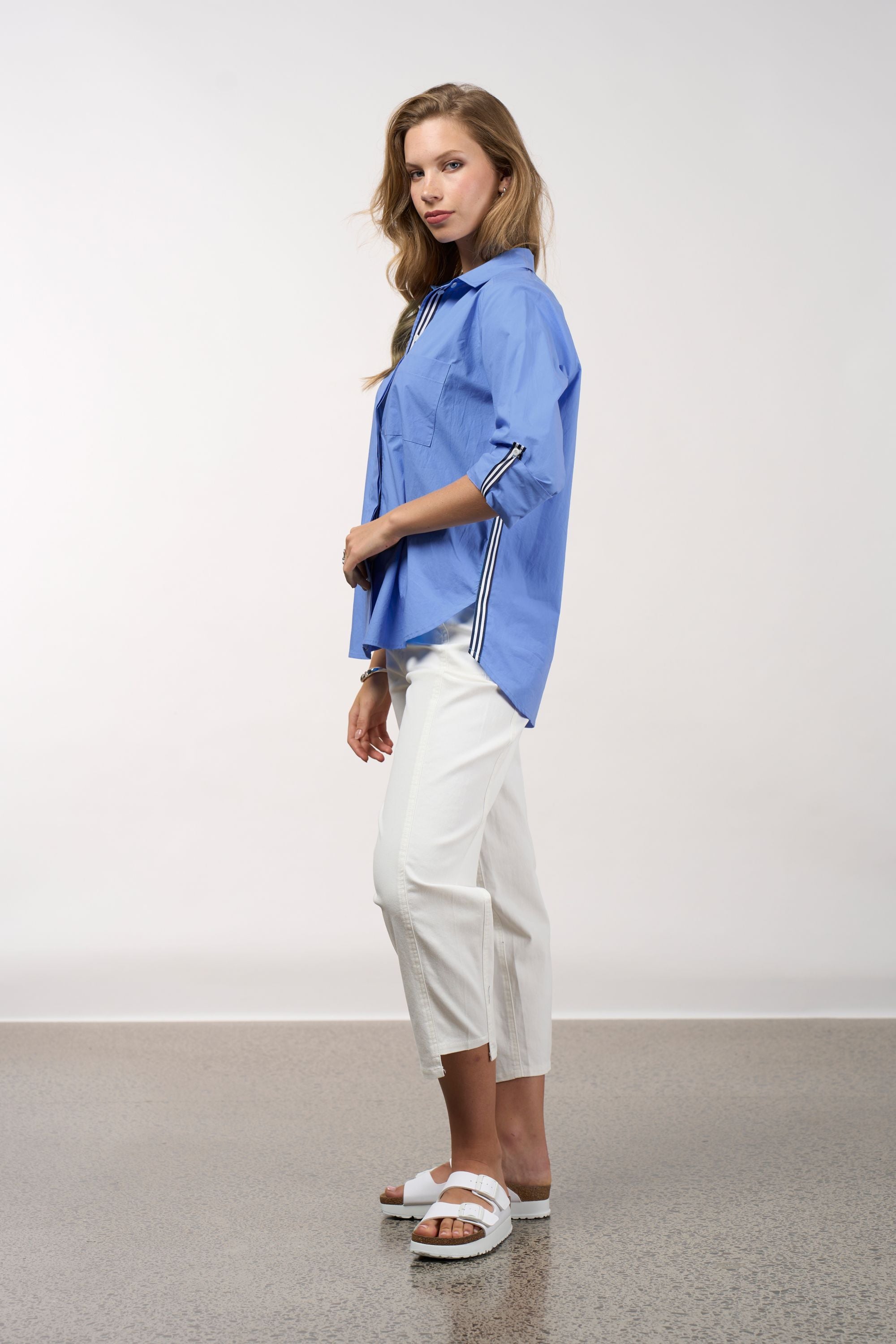 womens shirt blue with stripe trims worn by model side view