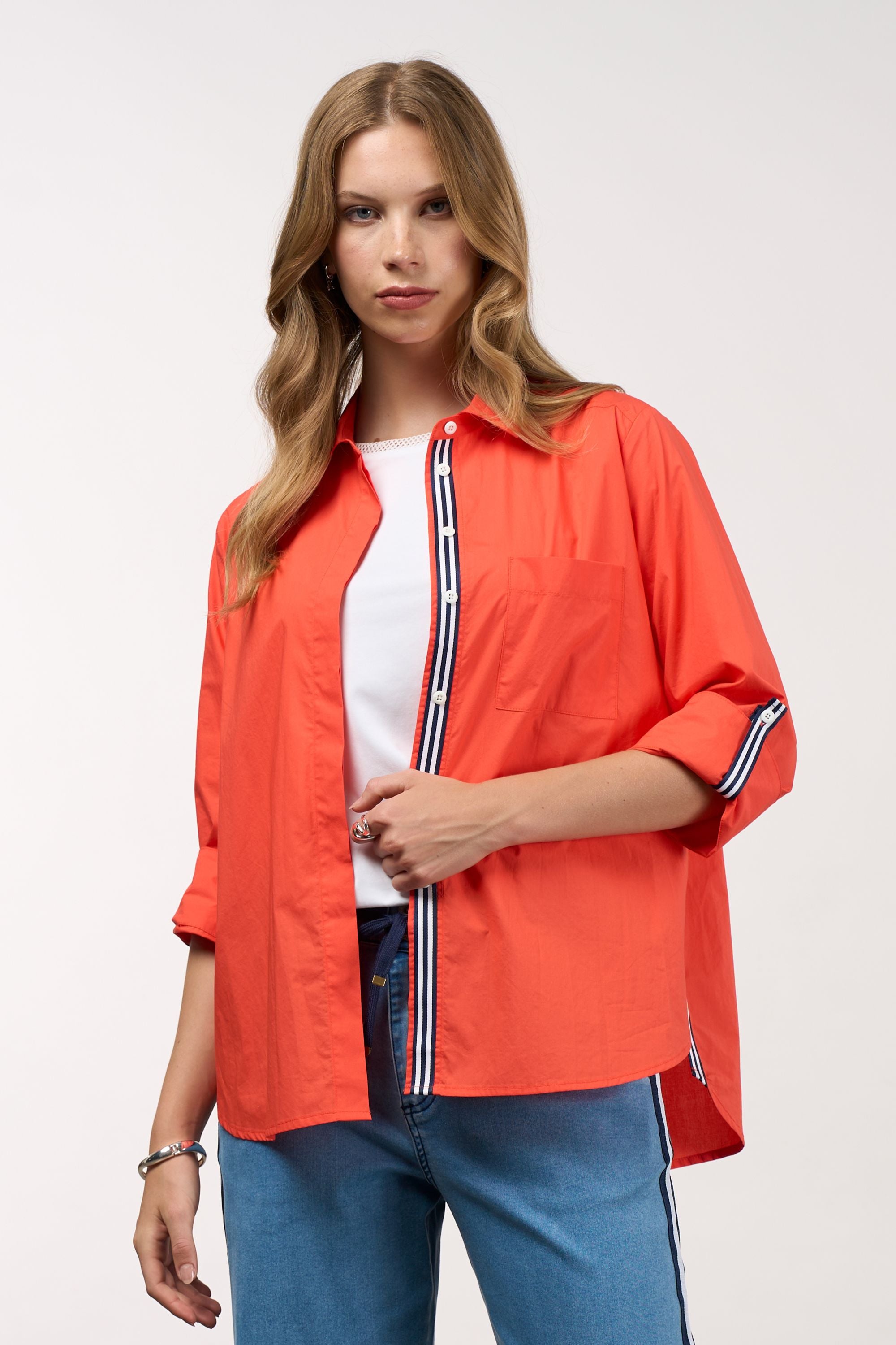womens shirt orange with stripe trims worn by model 