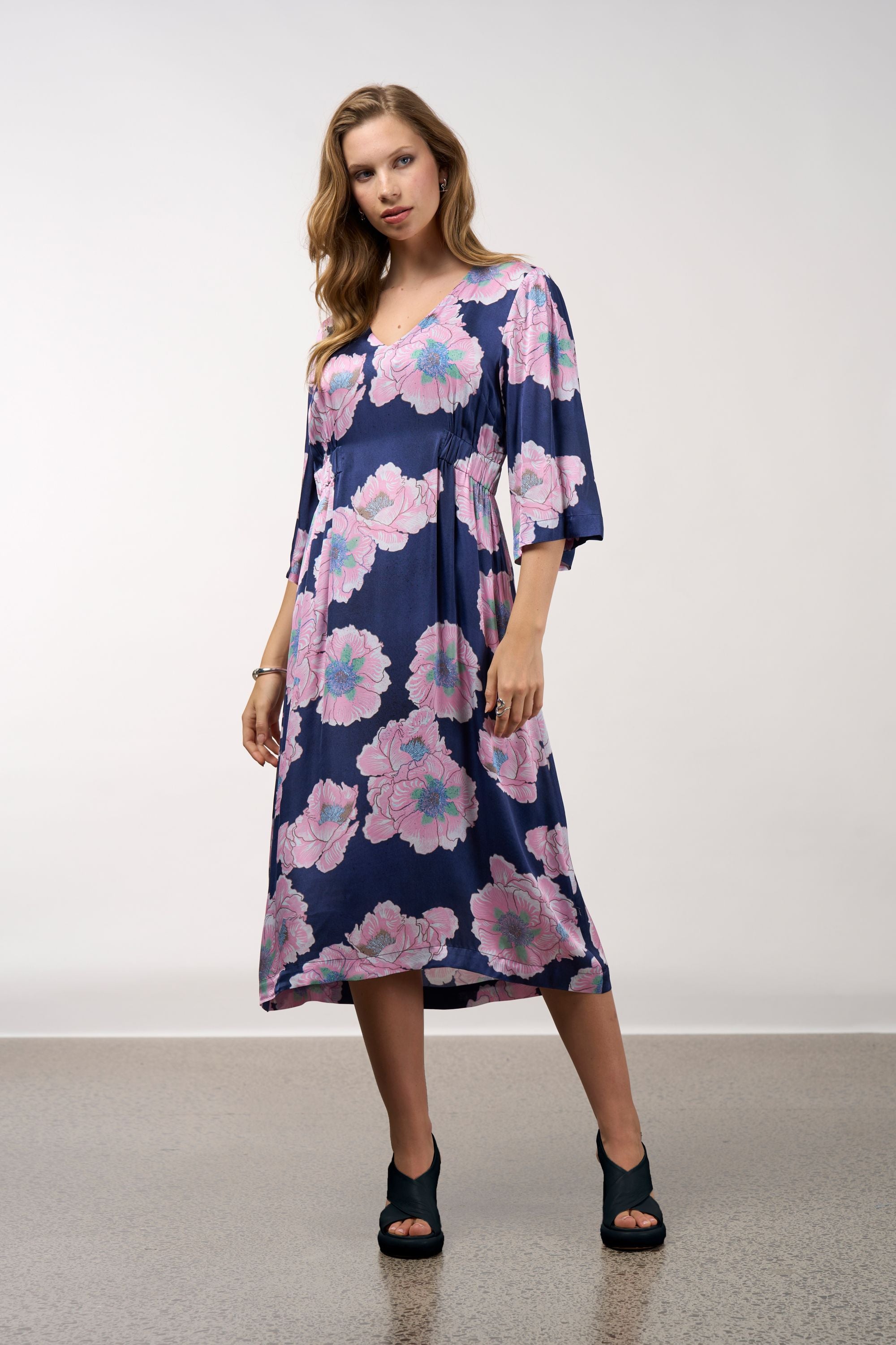 midi dress in navy with pink flowers worn by model 