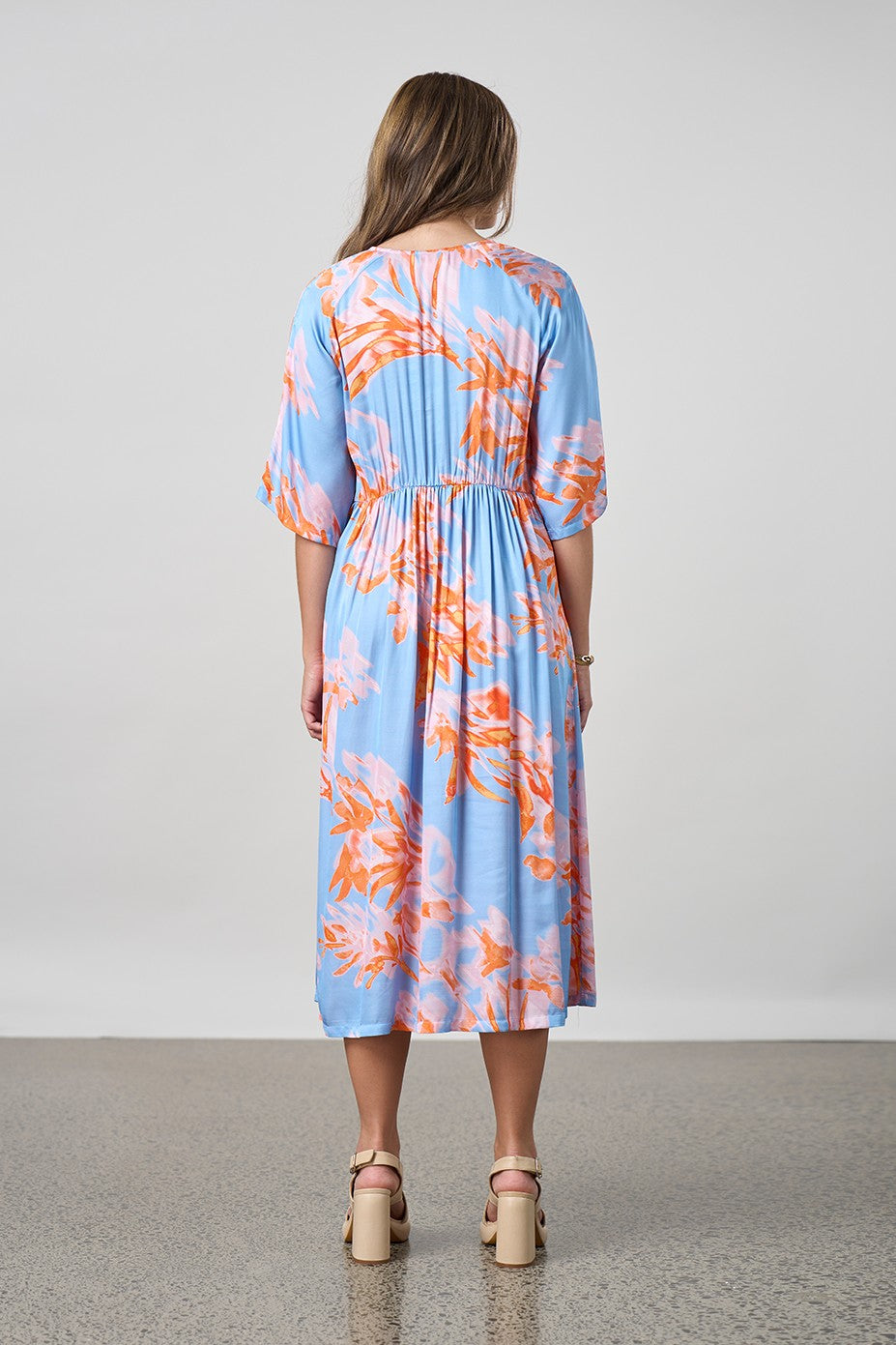 sky blue with coral floral midi dress worn by model back view