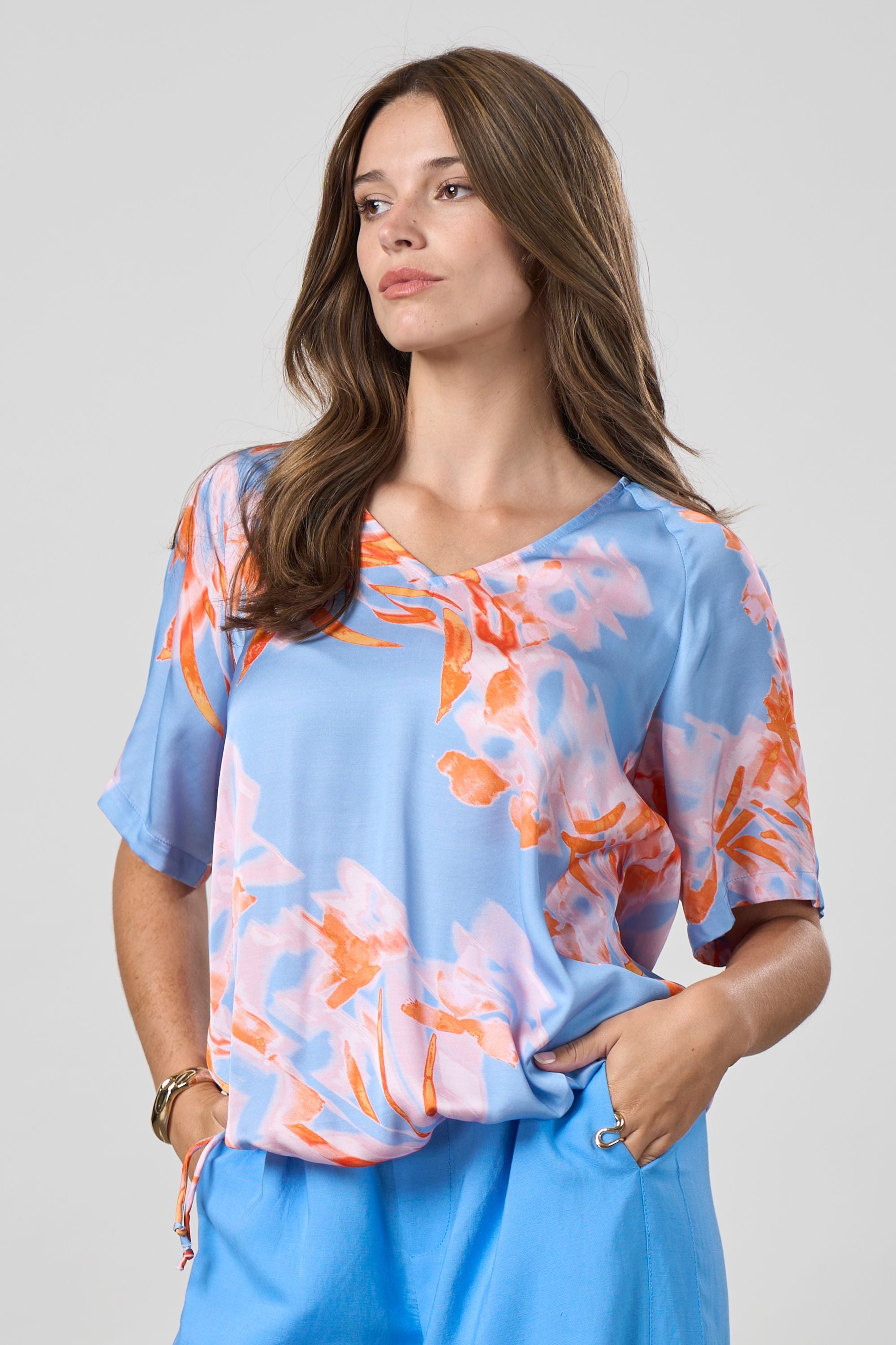 blue with coral floral top worn by model 