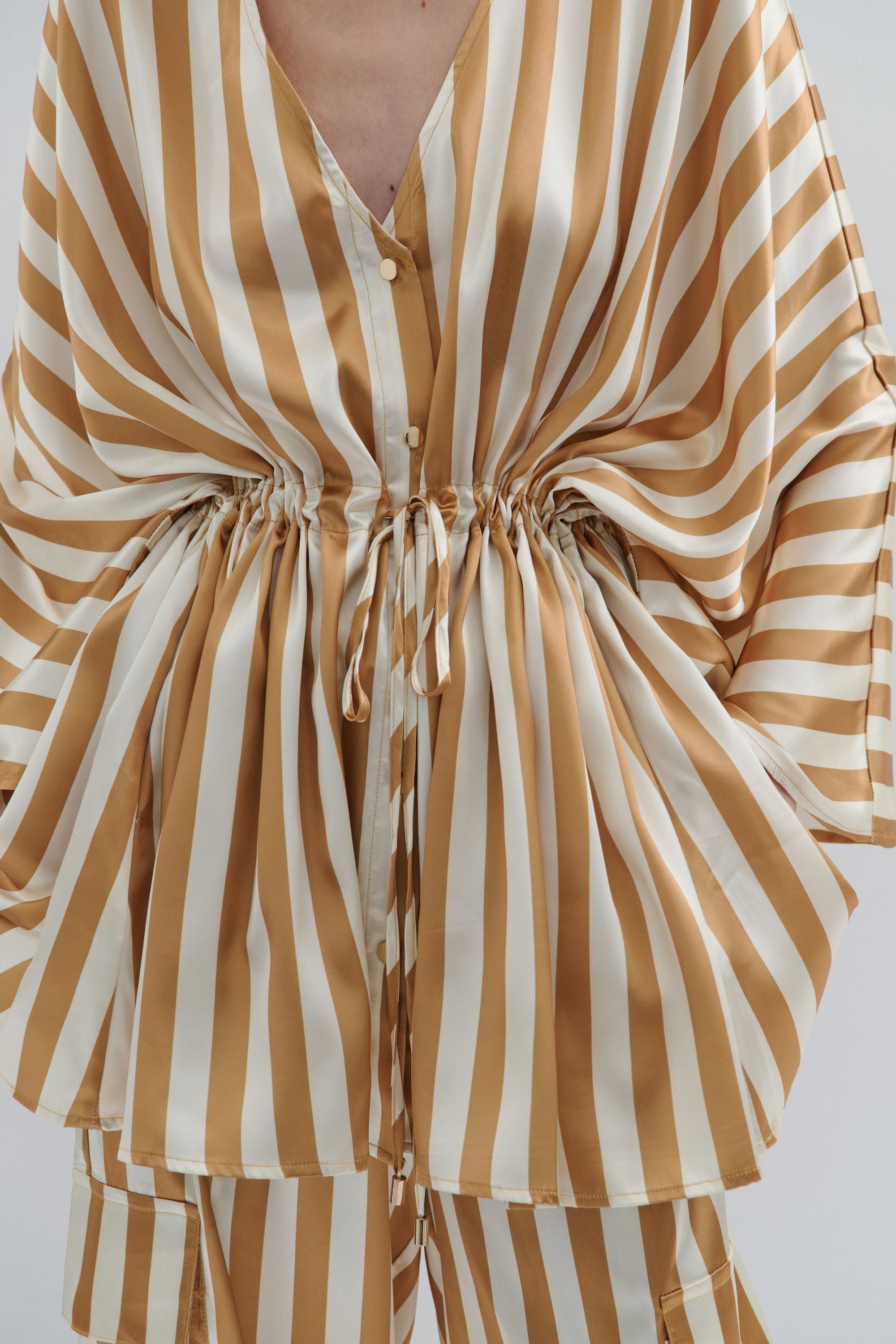 cream and gold satin stripe kimono worn by model 