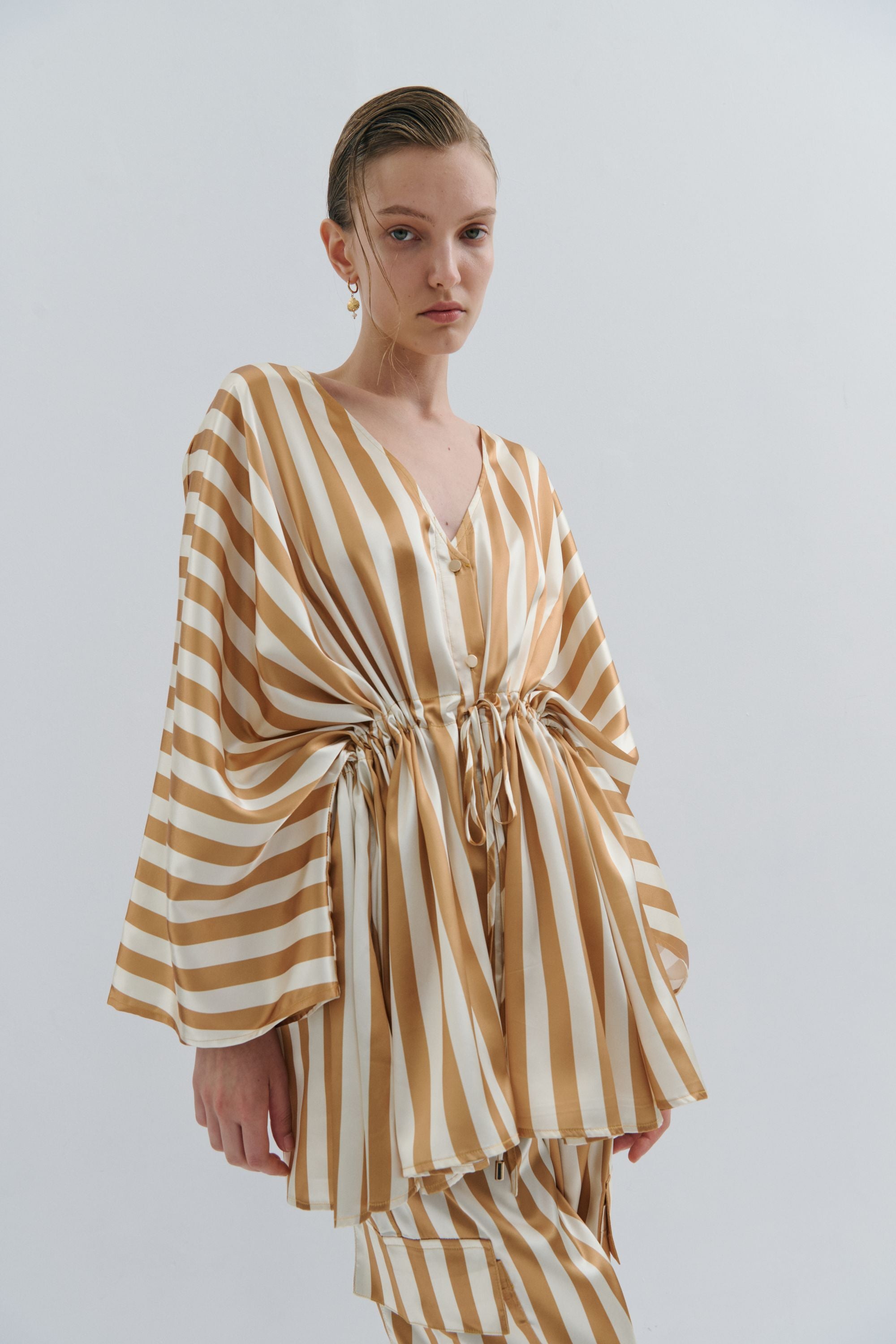 cream and gold satin stripe kimono worn by model 