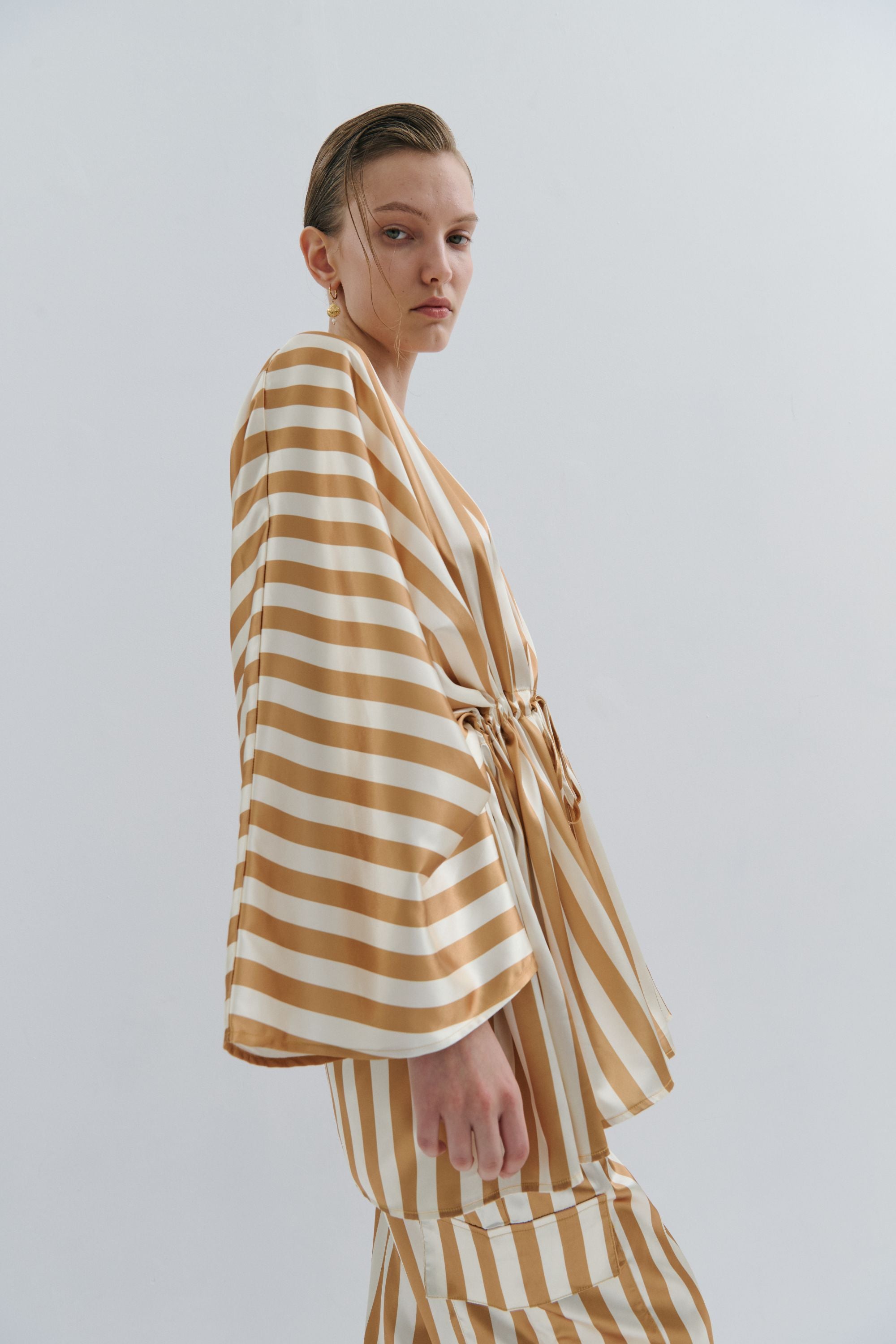 cream and gold satin stripe kimono worn by model 