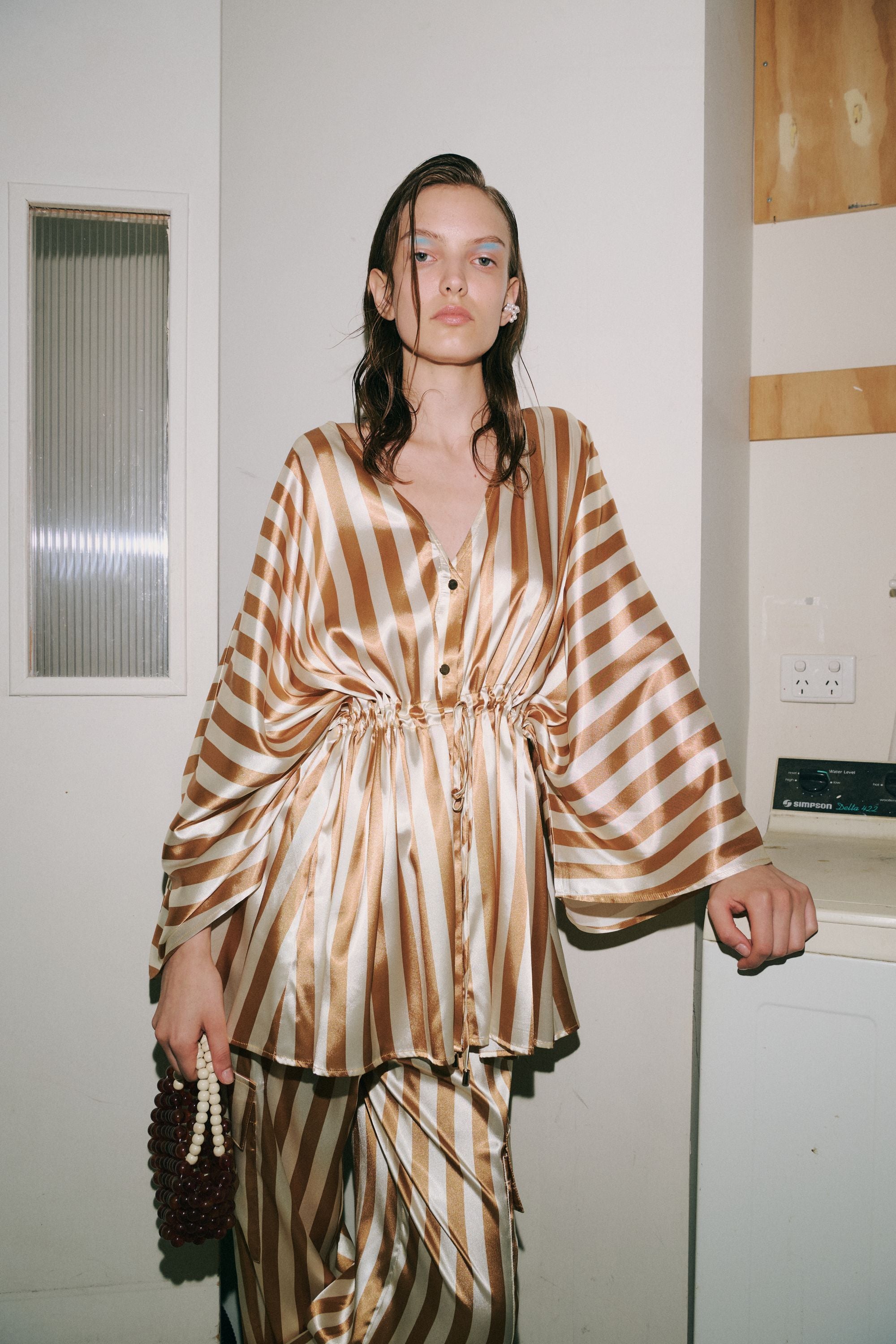 cream and gold satin stripe kimono worn by model 