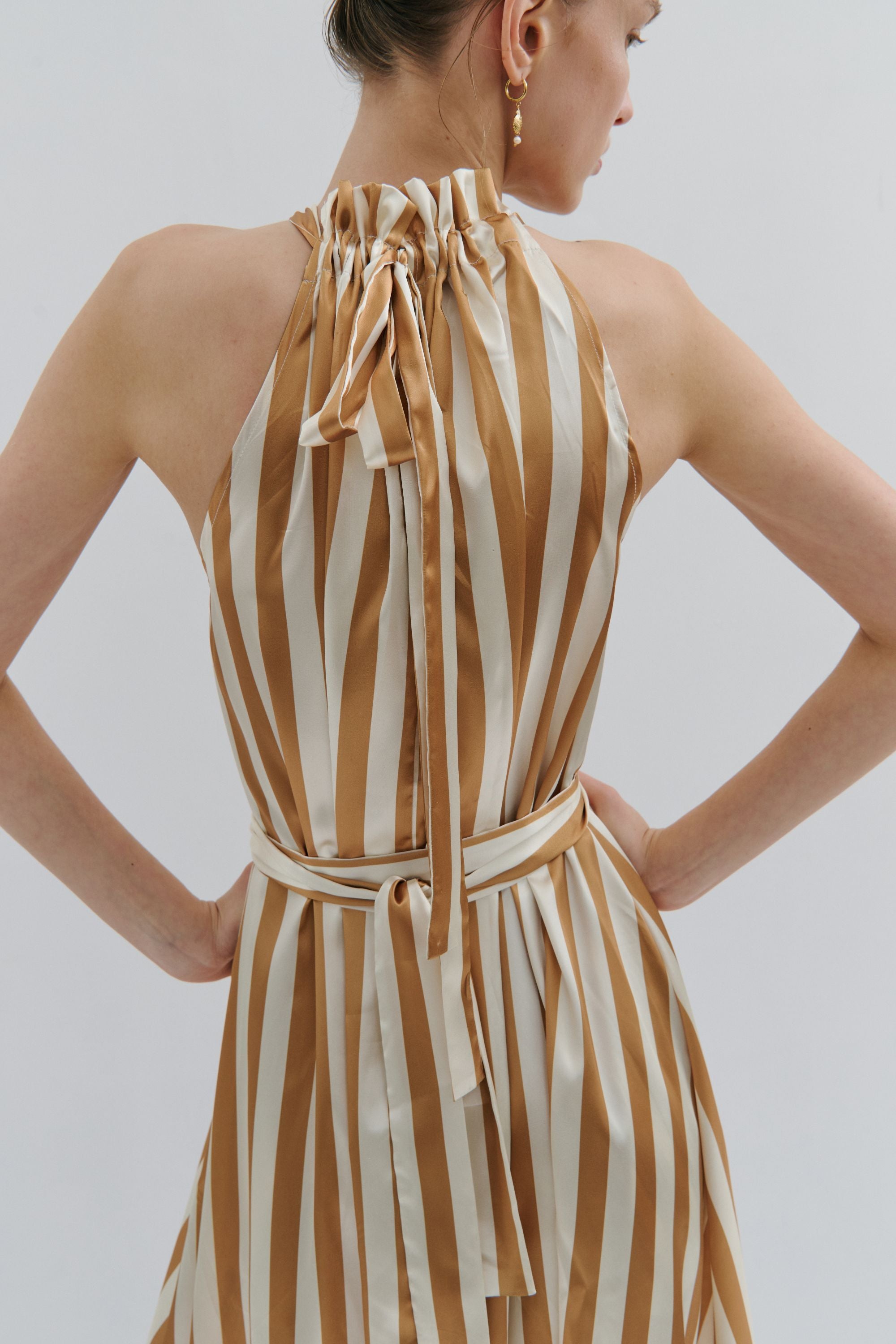 maxi dress gold and cream pinstripe worn by model back
