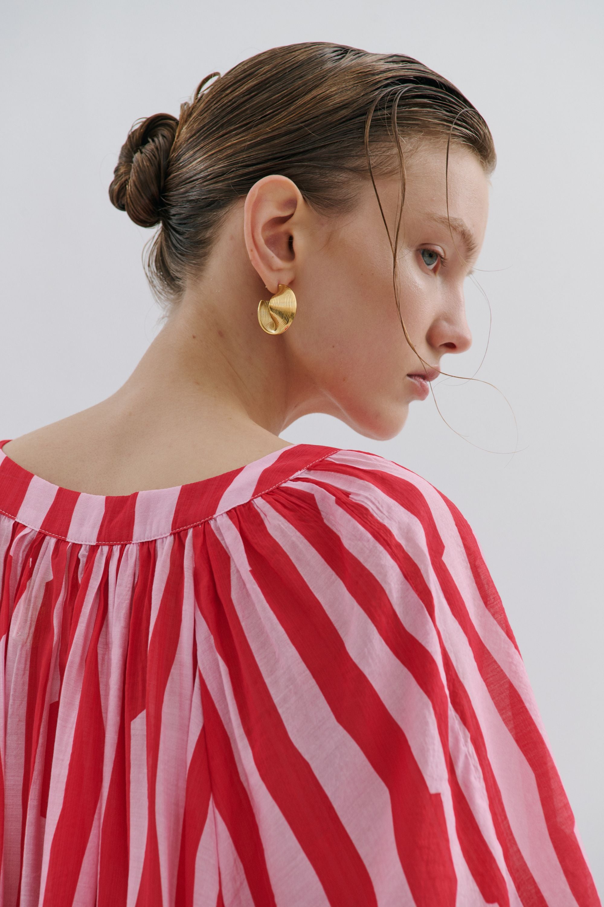 red pink stripe short dress shirt worn by model close up