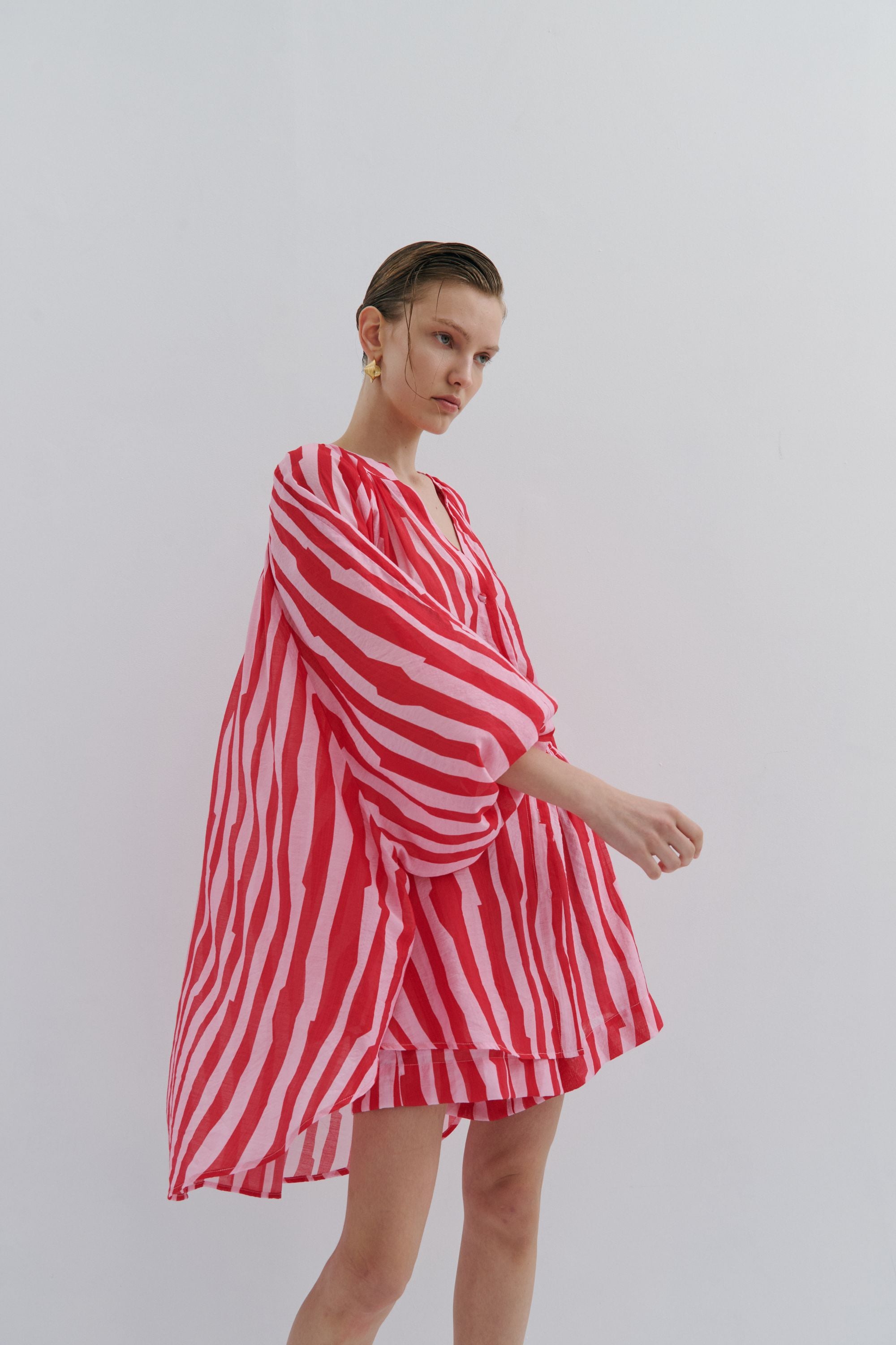 red pink stripe short dress shirt worn by model 