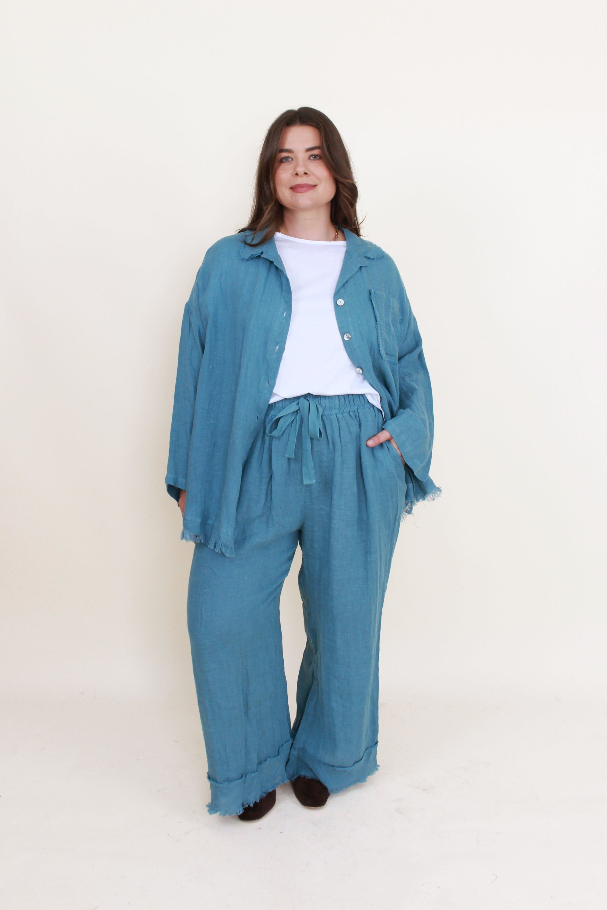 Linen frey hem shirt and pants blue worn by model 