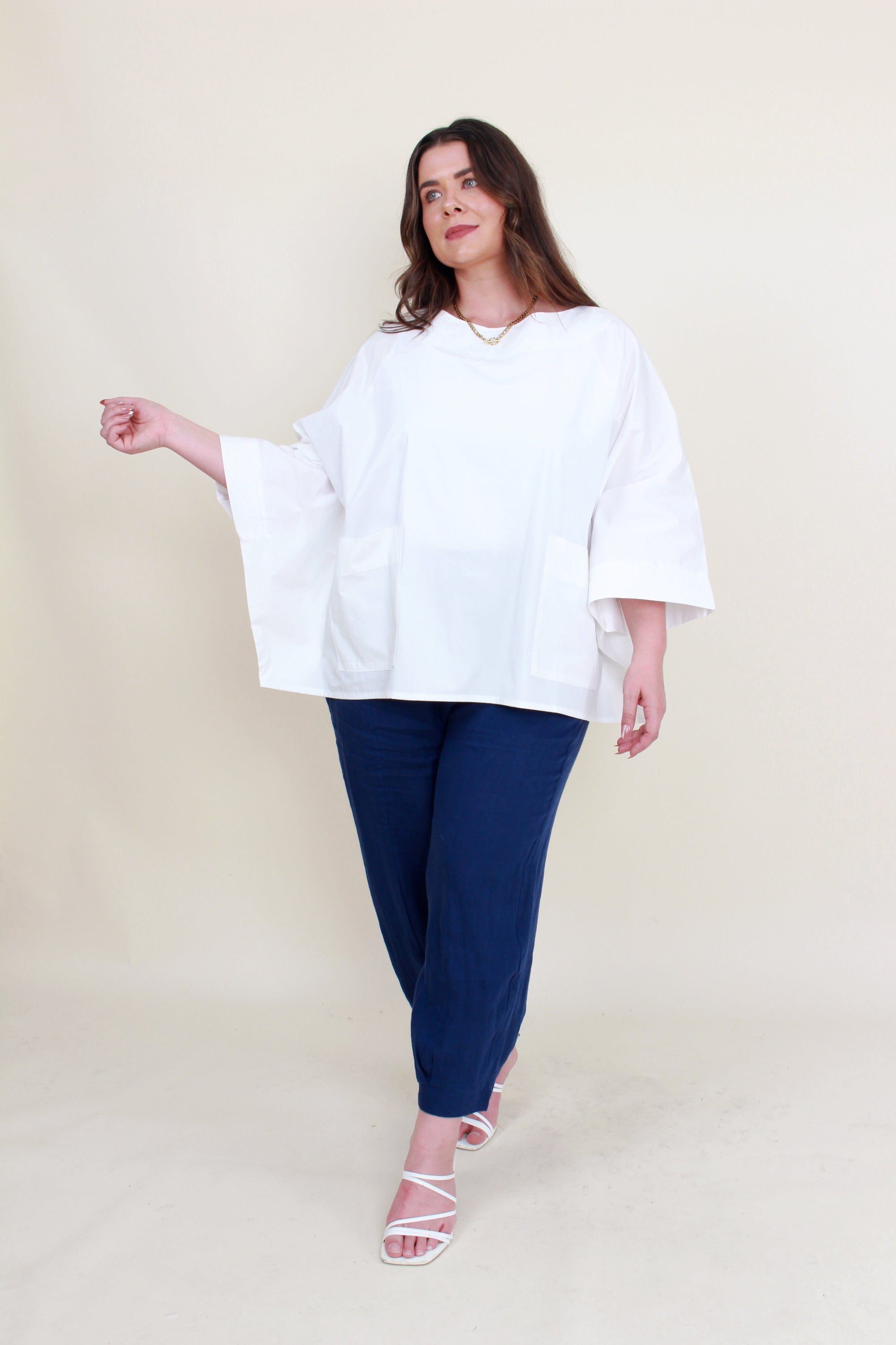 womens boxy patch pocket top in white with navy pant worn by model 