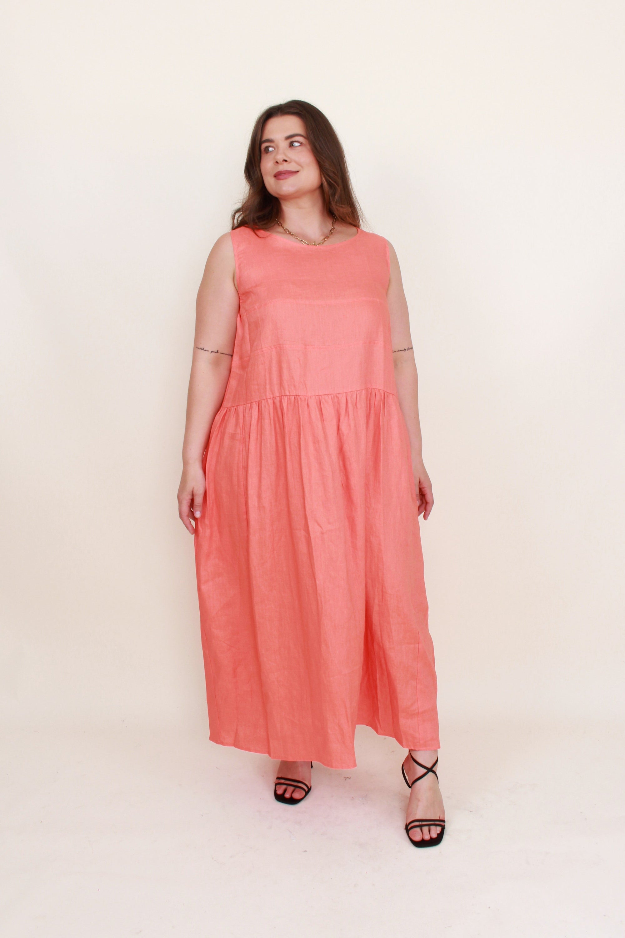 sleeveless linen midi dress persimmon coral worn by model