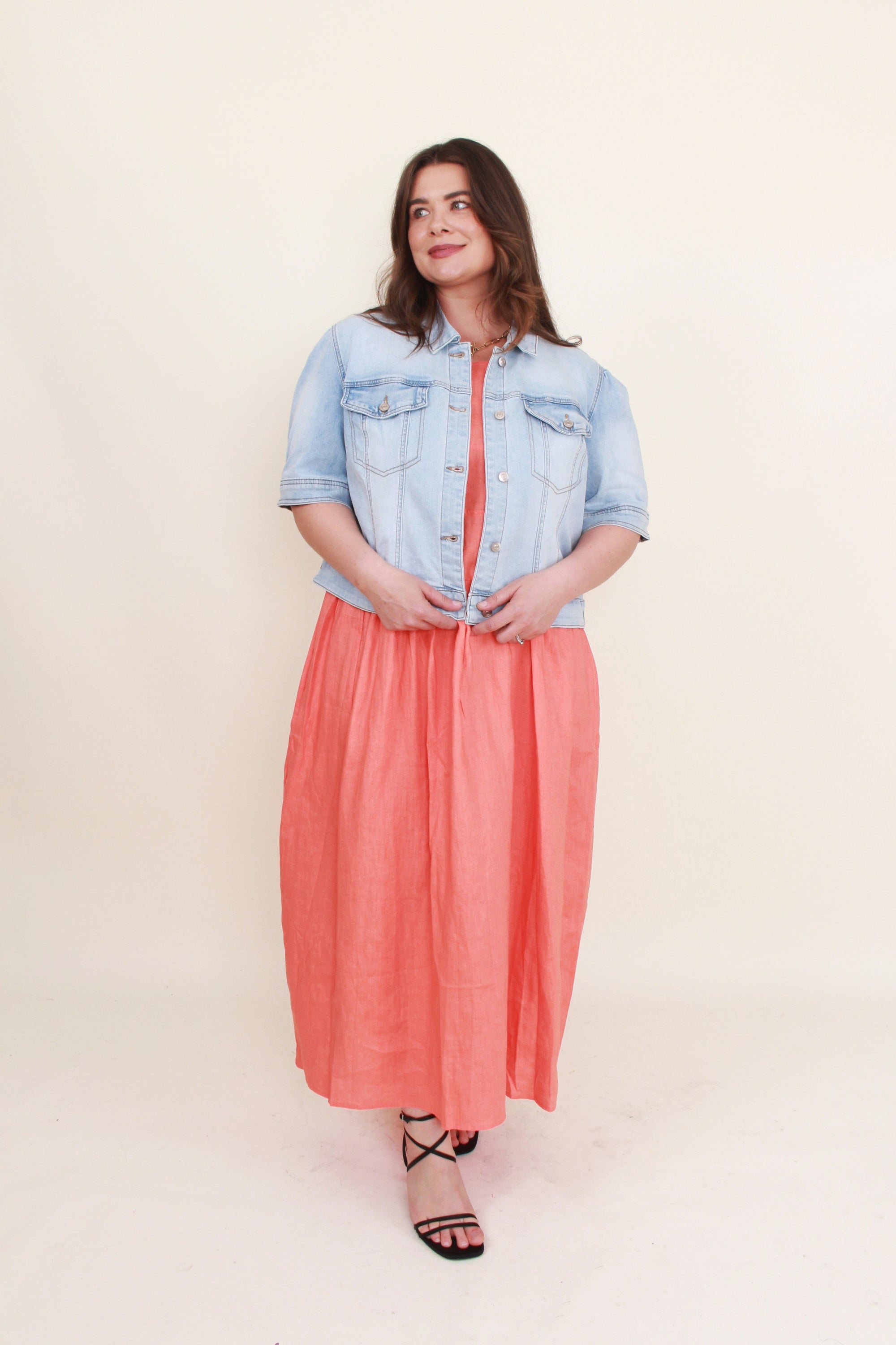 womens cropped denim jacket with coral dress worn by model