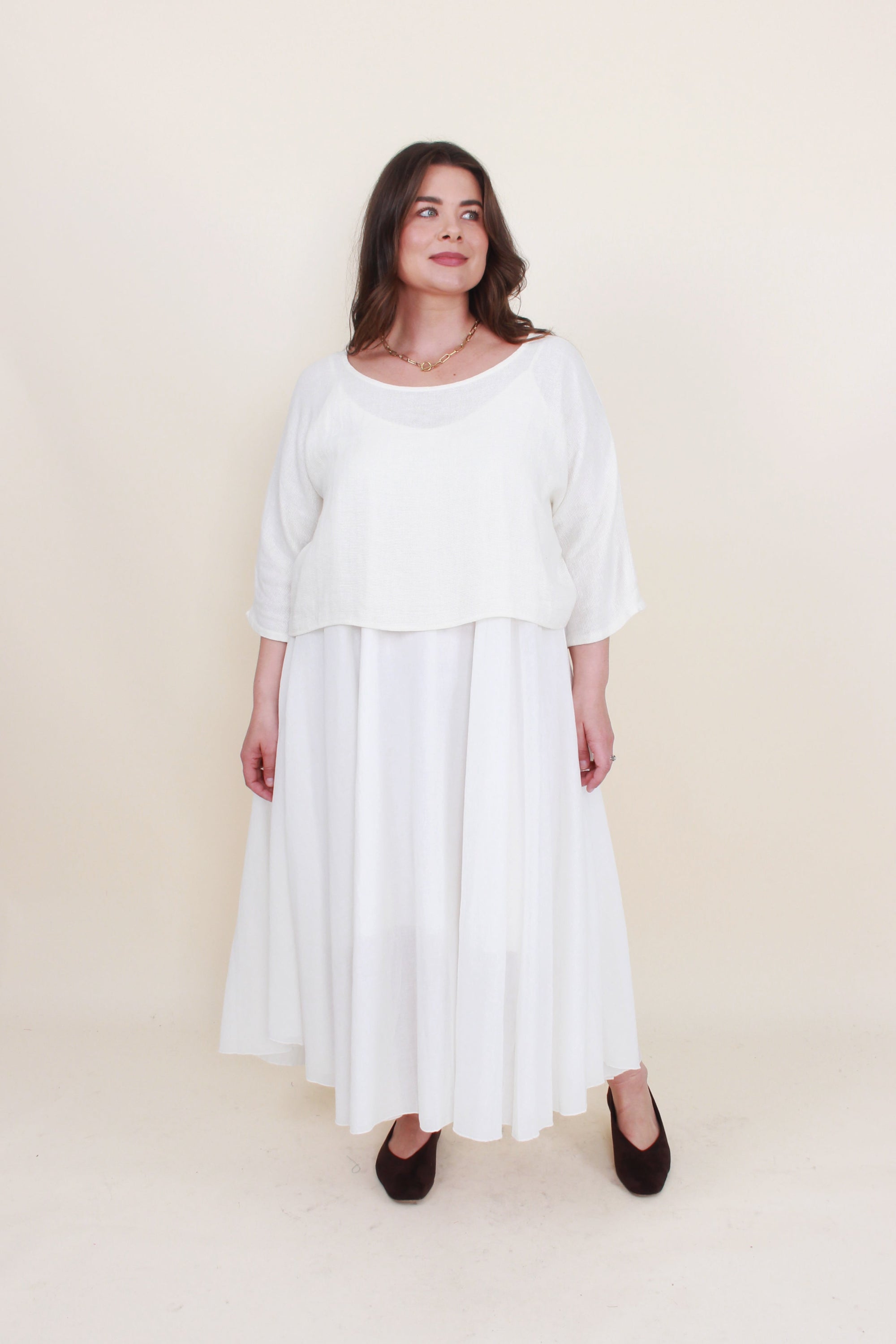 Off white 2 piece dress set worn by model