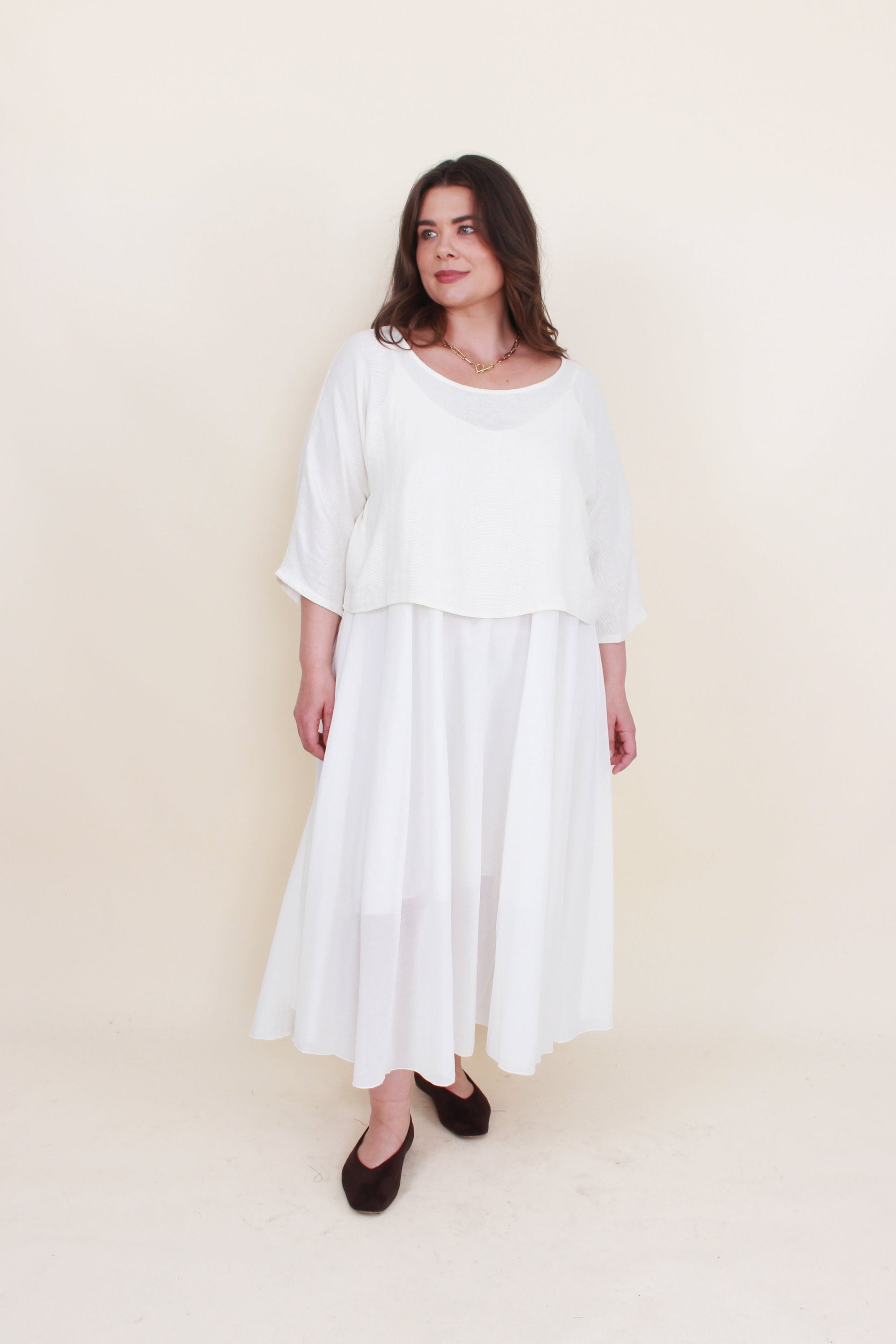 Off white 2 piece dress set worn by model