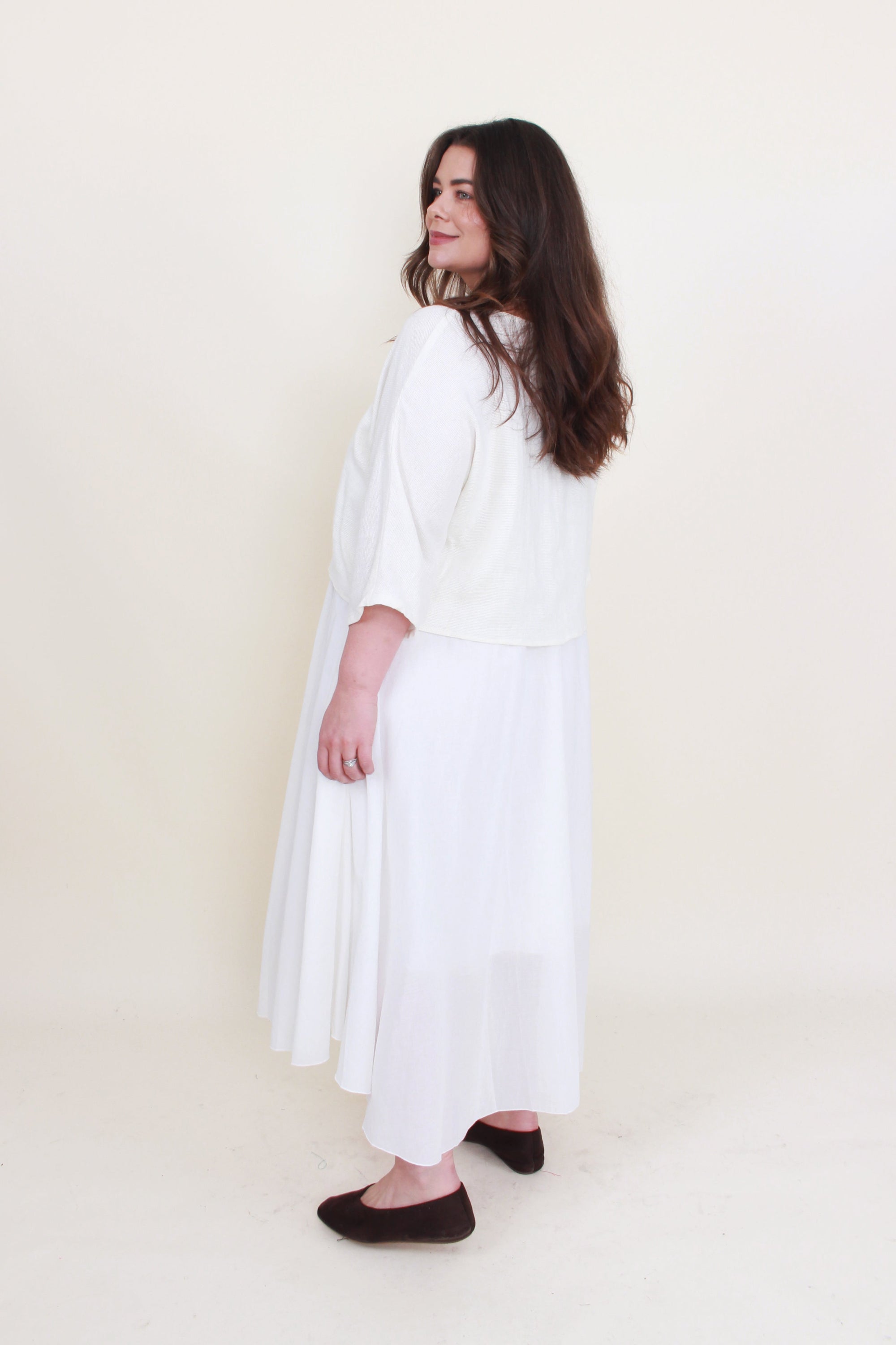 Off white 2 piece dress set worn by model