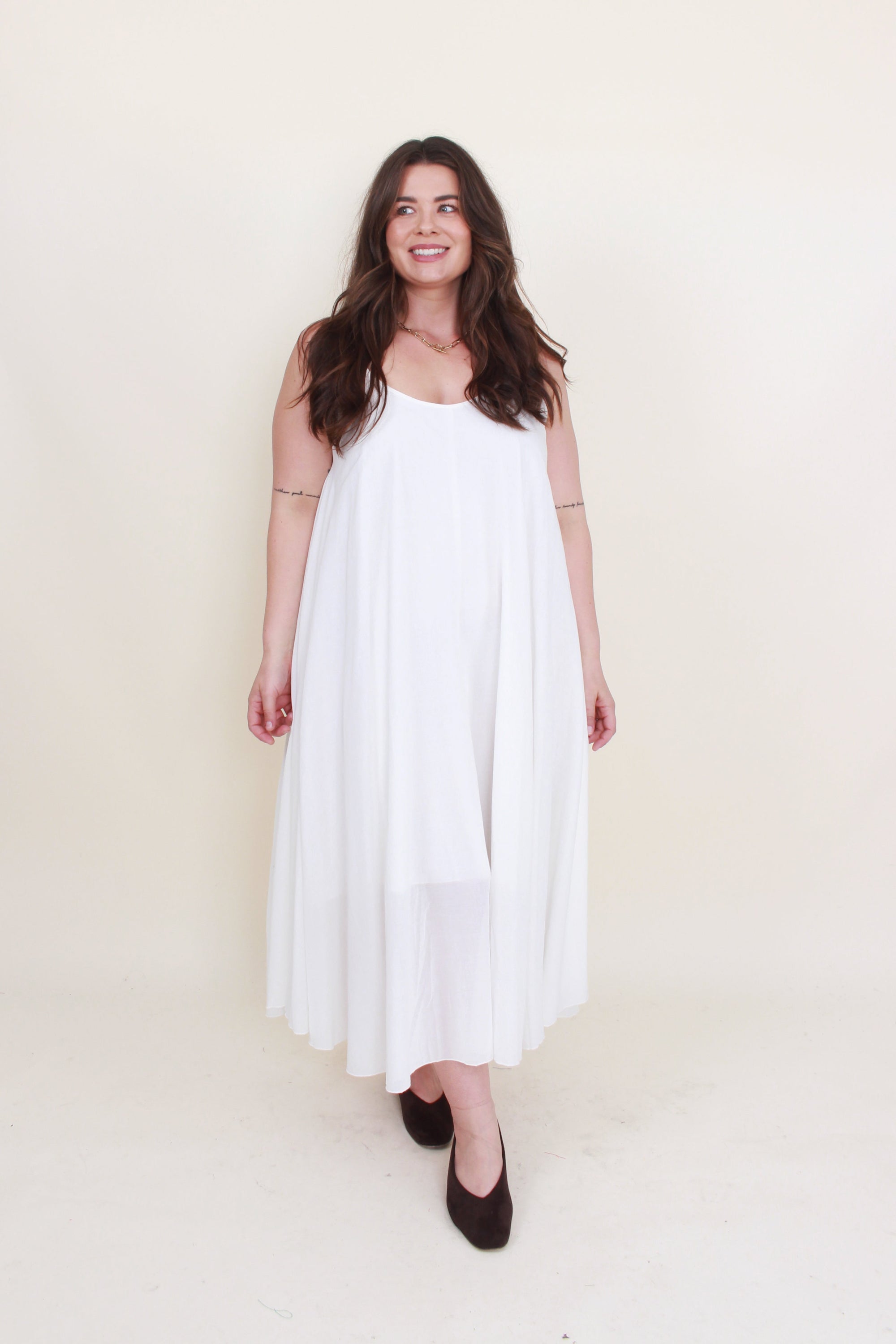 Off white sleeveless dress set worn by model