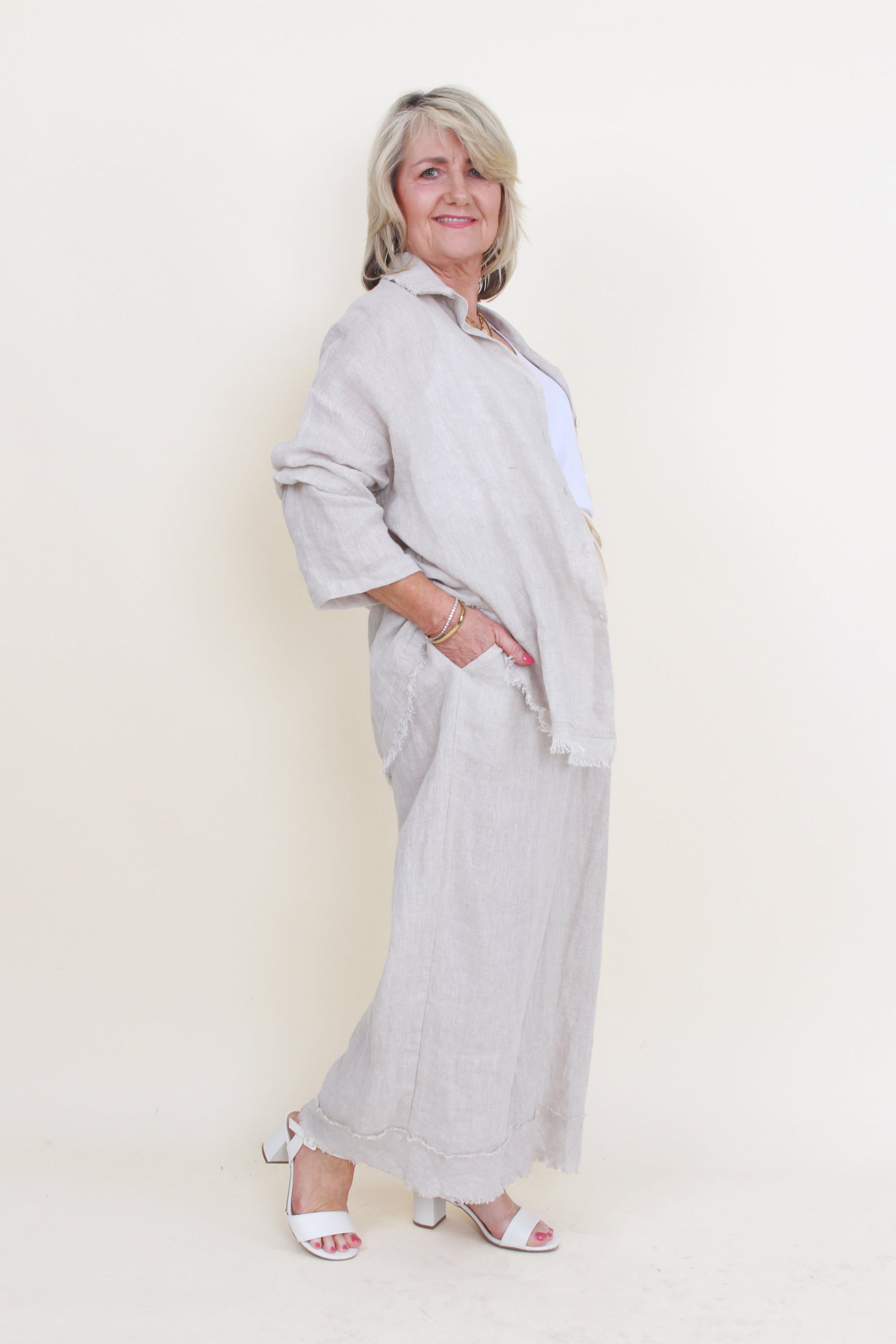 wmones wide leg fray hem pants and matching shirt colour sand on model