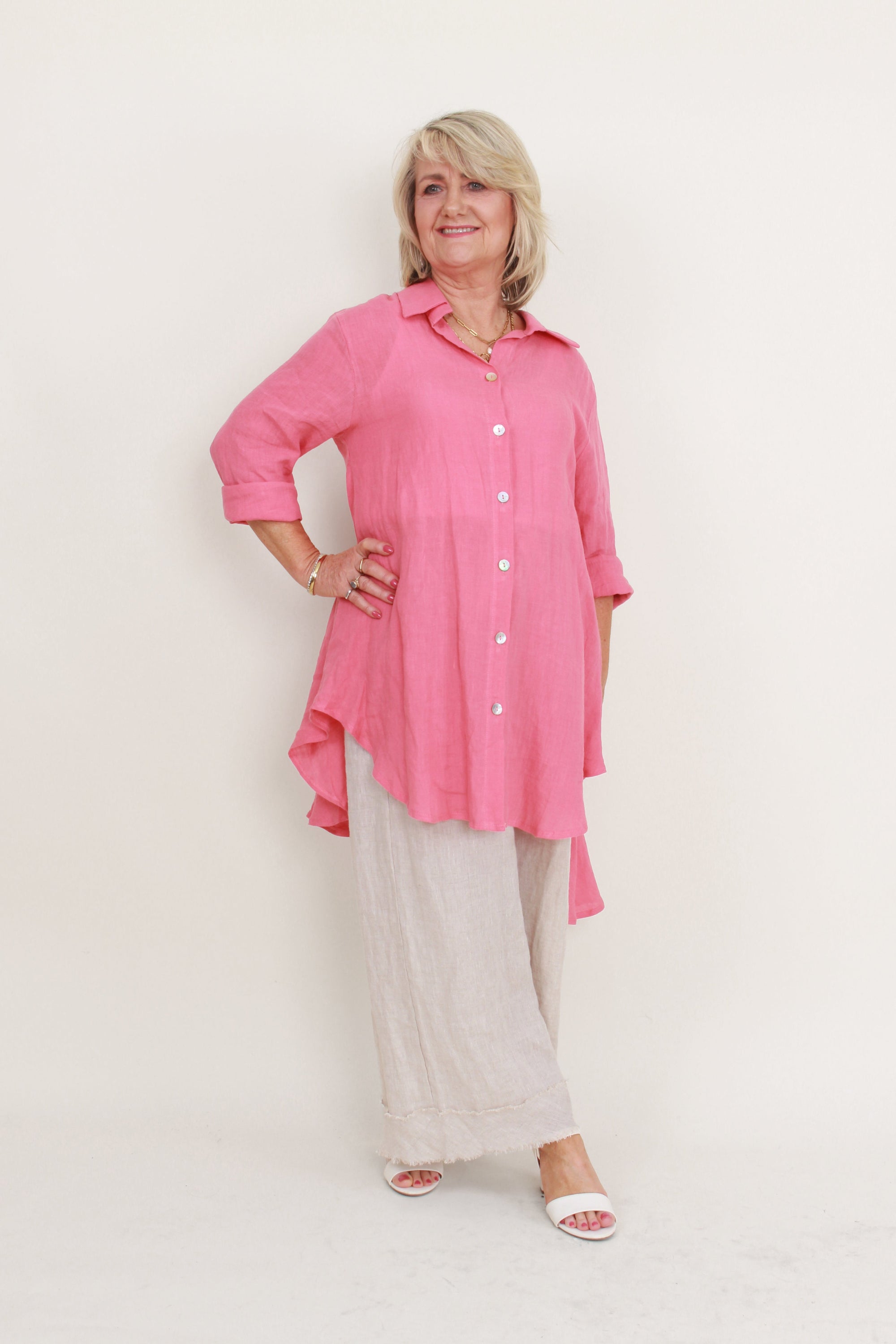 womens high low swing button through top in melon worn by model