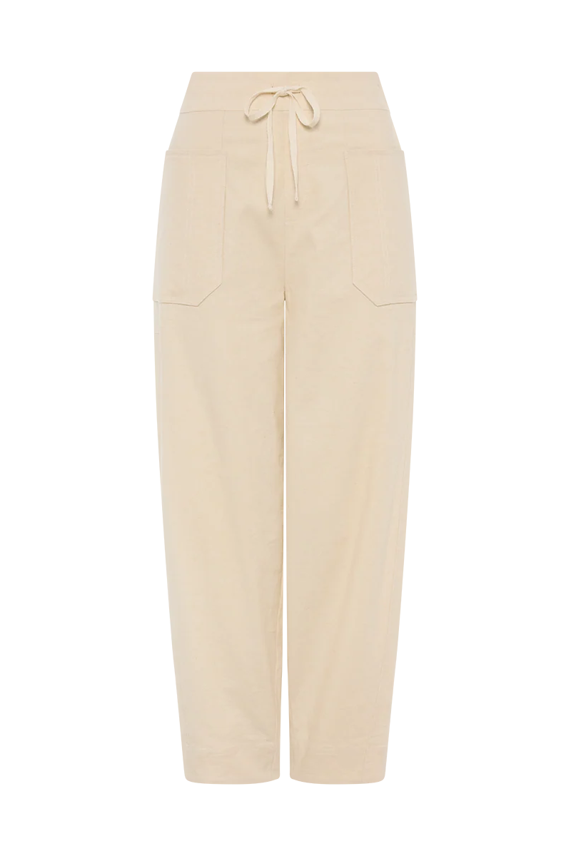 A pair of high-waisted, straight-leg cropped pants in a light cream or beige color, featuring a drawstring waistband and two large front patch pockets, shown against a plain white background.