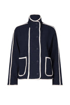 Navy jacket with white trim on a white background