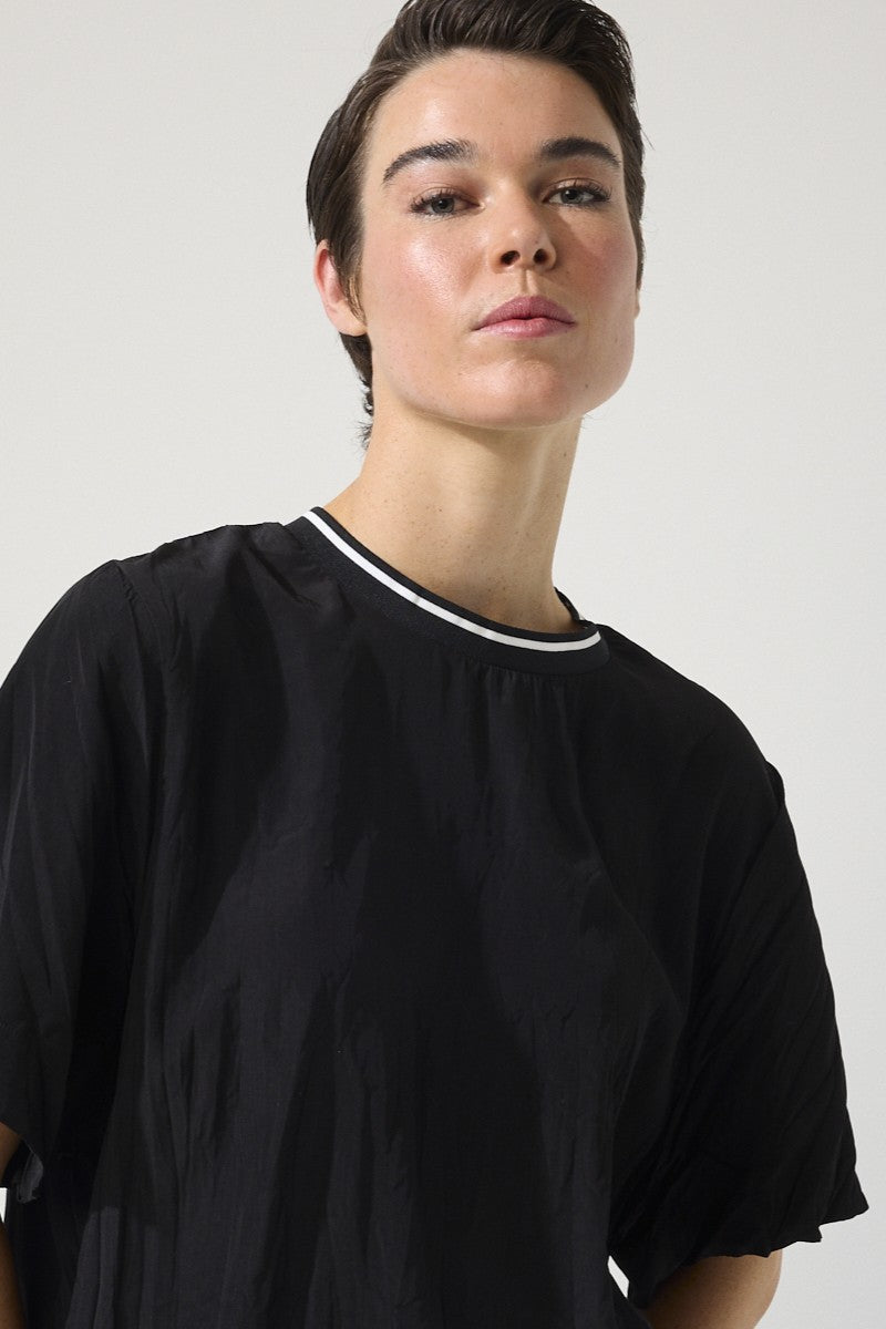 womens relaxed fit tee with crinkle texture contrast crew neck black worn by model close up