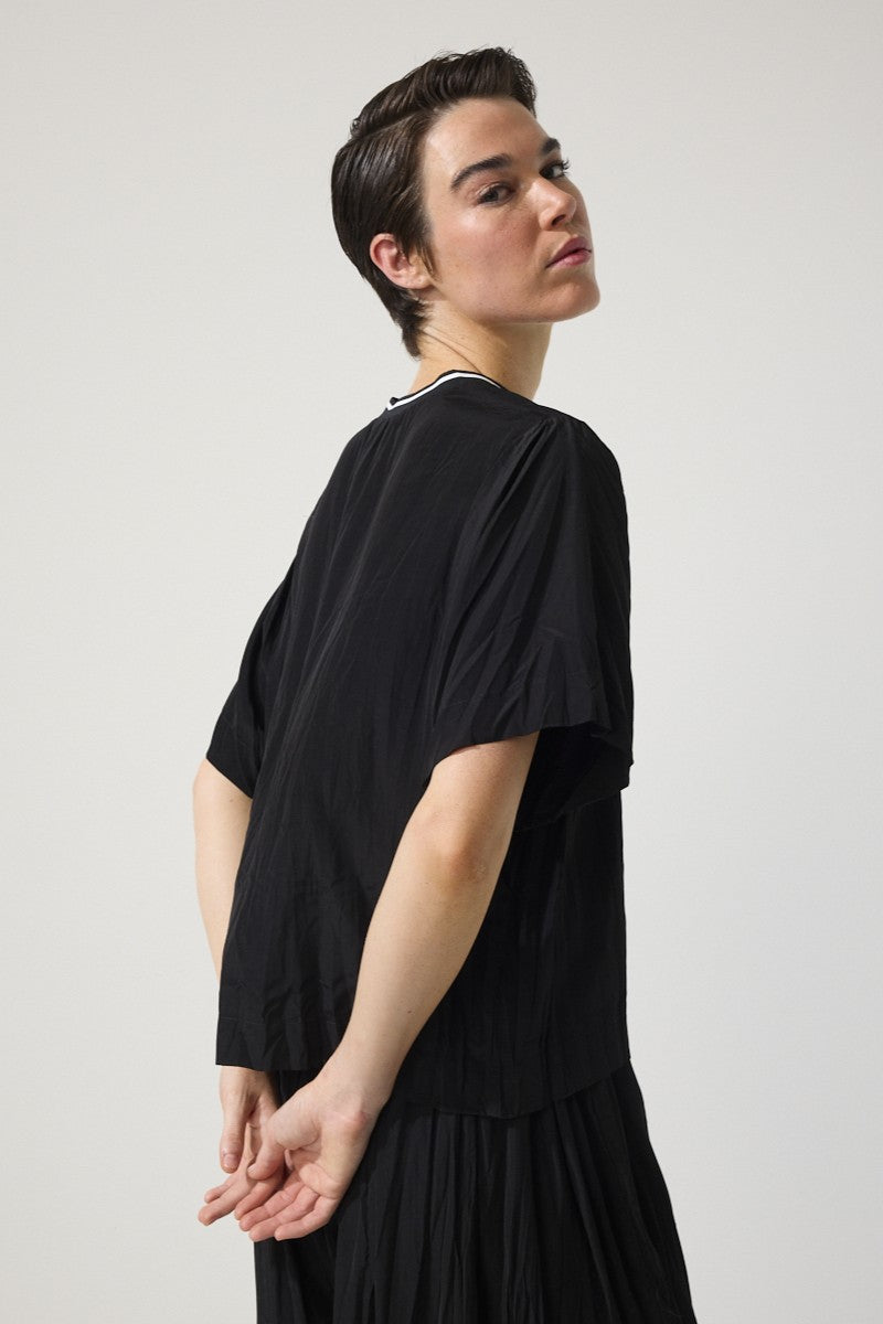 womens relaxed fit tee with crinkle texture contrast crew neck black worn by model side view