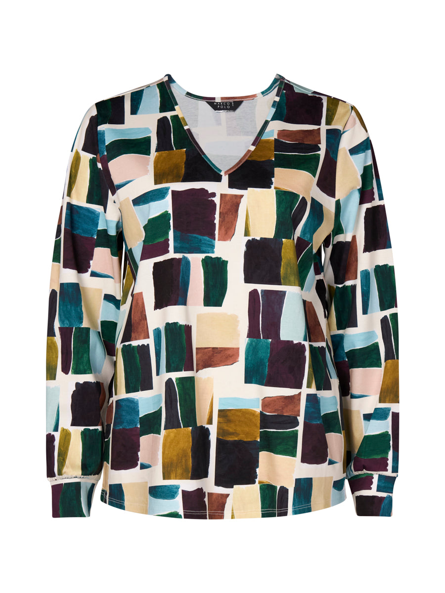 Multicolored mosaic patterned shirt on a white background