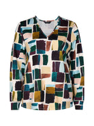 Multicolored mosaic patterned shirt on a white background
