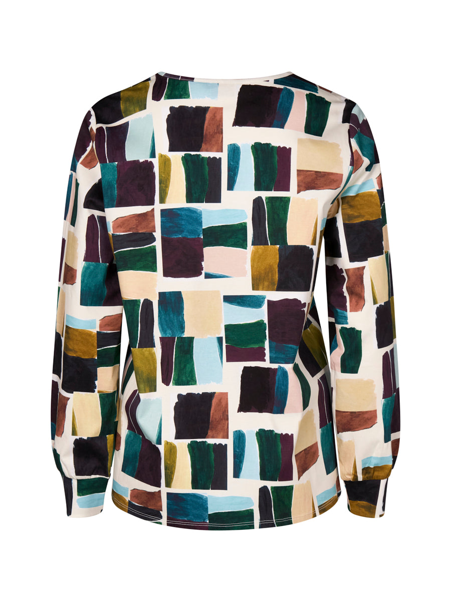 Colorful patterned shirt with geometric design on a white background back angle