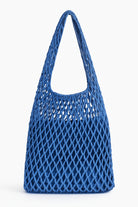 Blue woven handbag on a white background