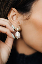 pearl and gold bee drop earrings on ear