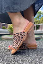 leopard print and tan sandal on foot