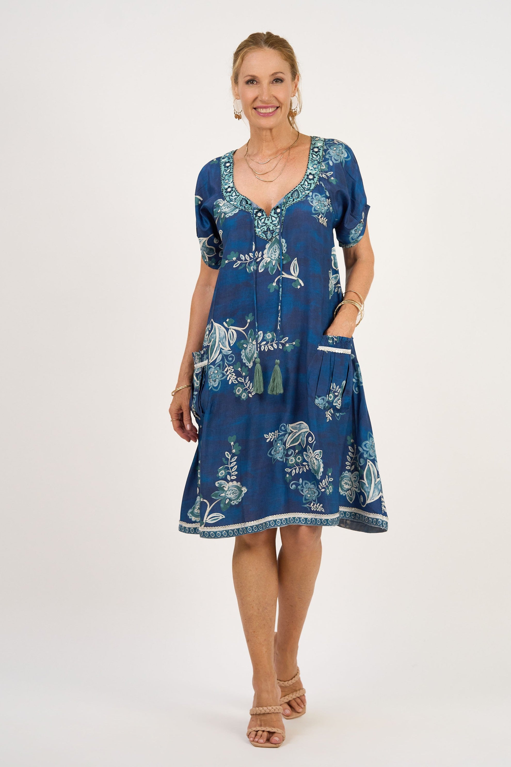 midi dress blue print with tassle tie neck worn by model 