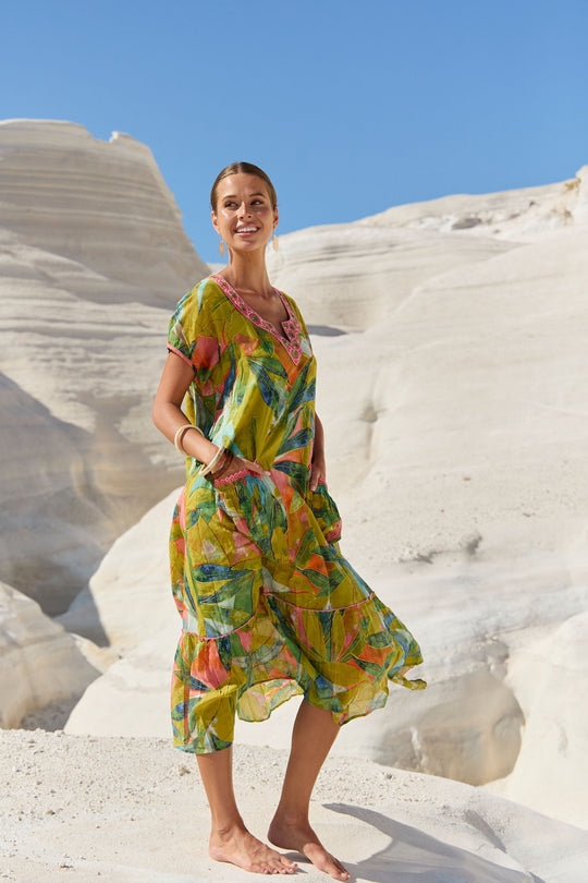 womens green multi leaf print midi dress worn by model outdoor campaign