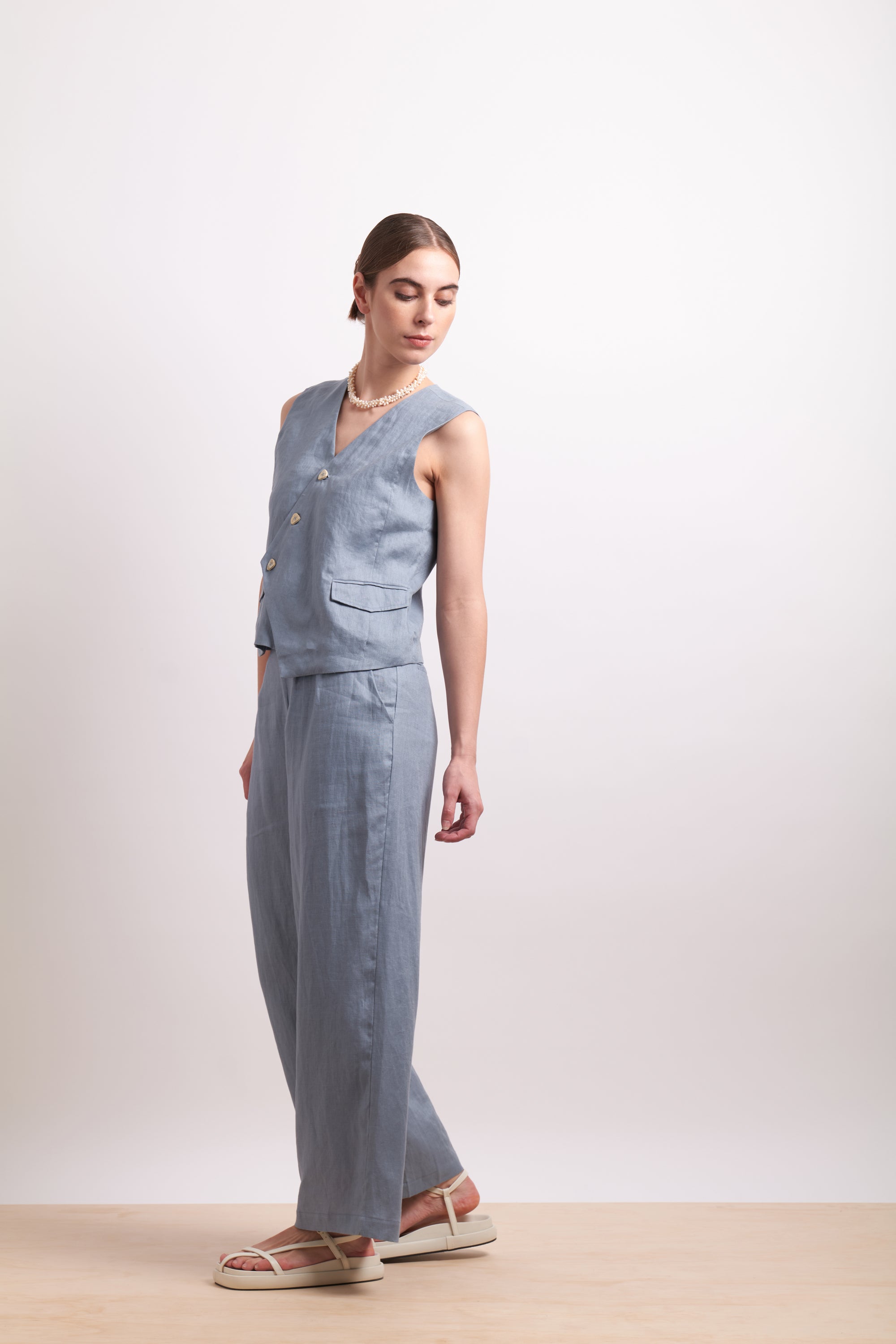 womens asymmertical button linen vest in light blue dove