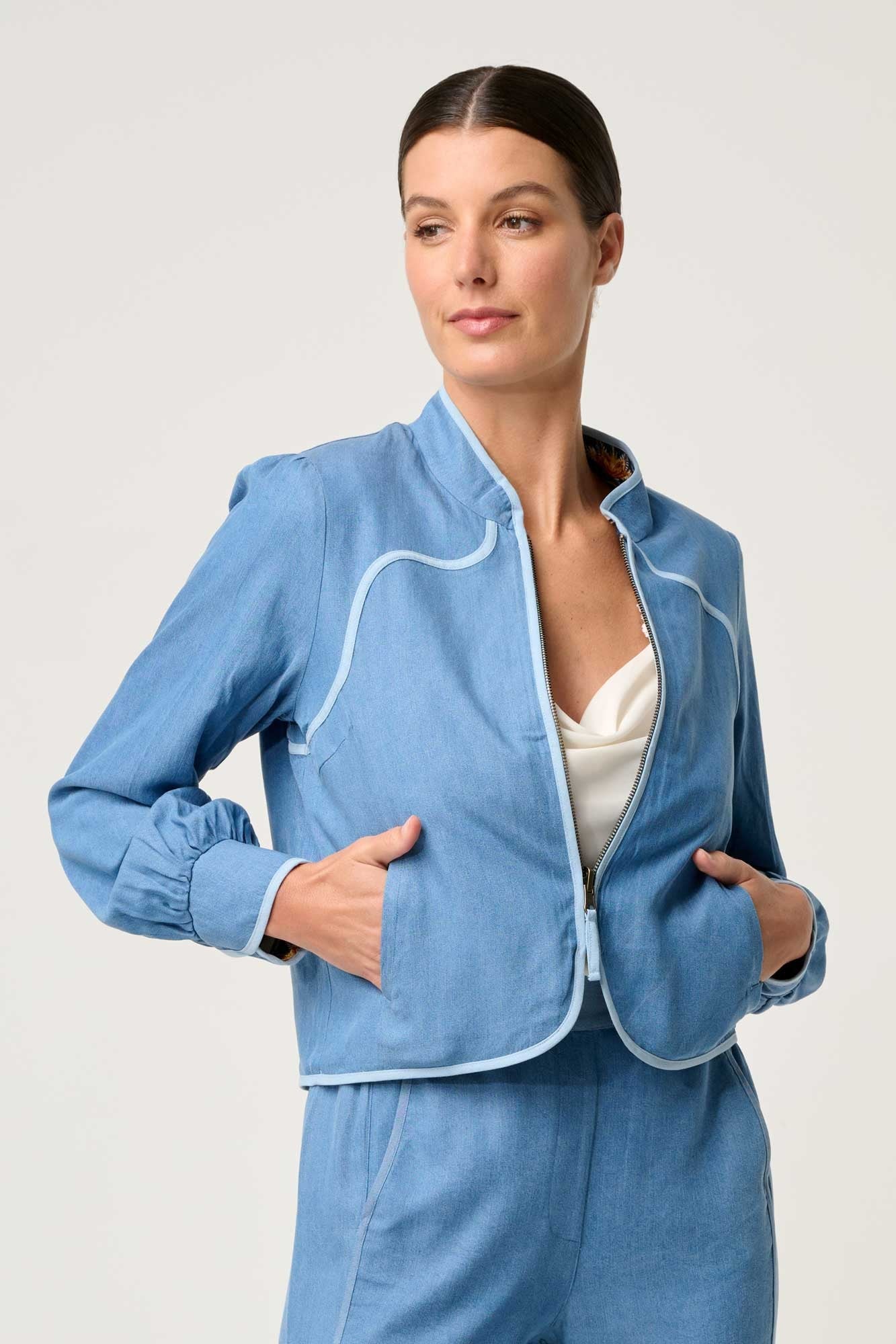 womens blue reversible jacket worn by model 