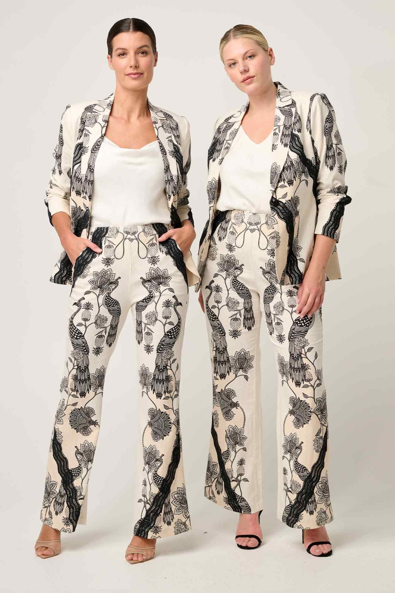 womens cream with black linework print blazer and pant worn by two models
