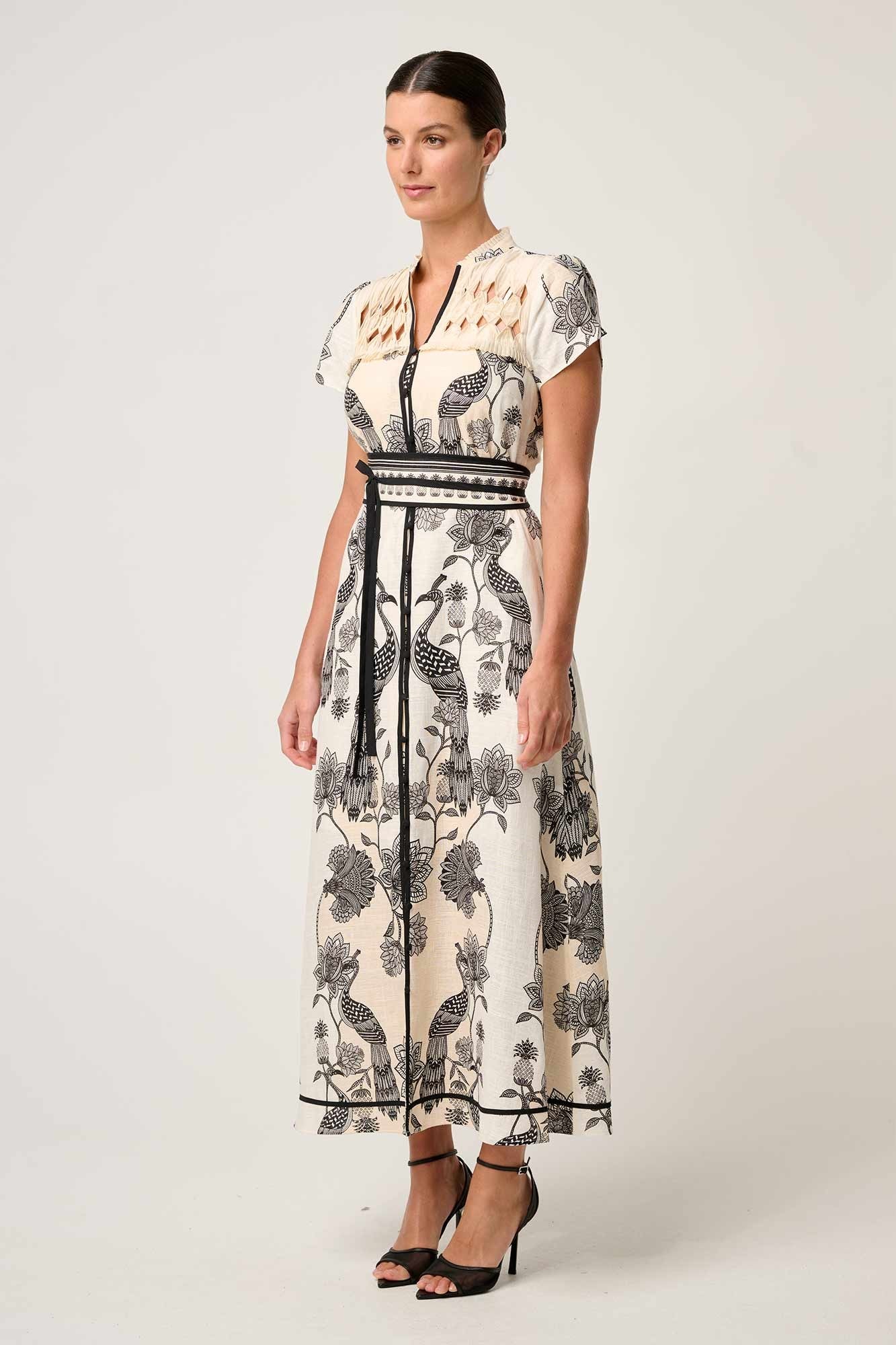 maxi dress cream with black linework worn by model 