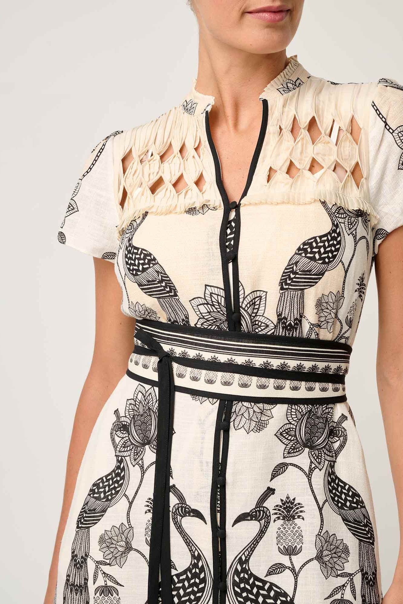 maxi dress cream with black linework worn by model  close up